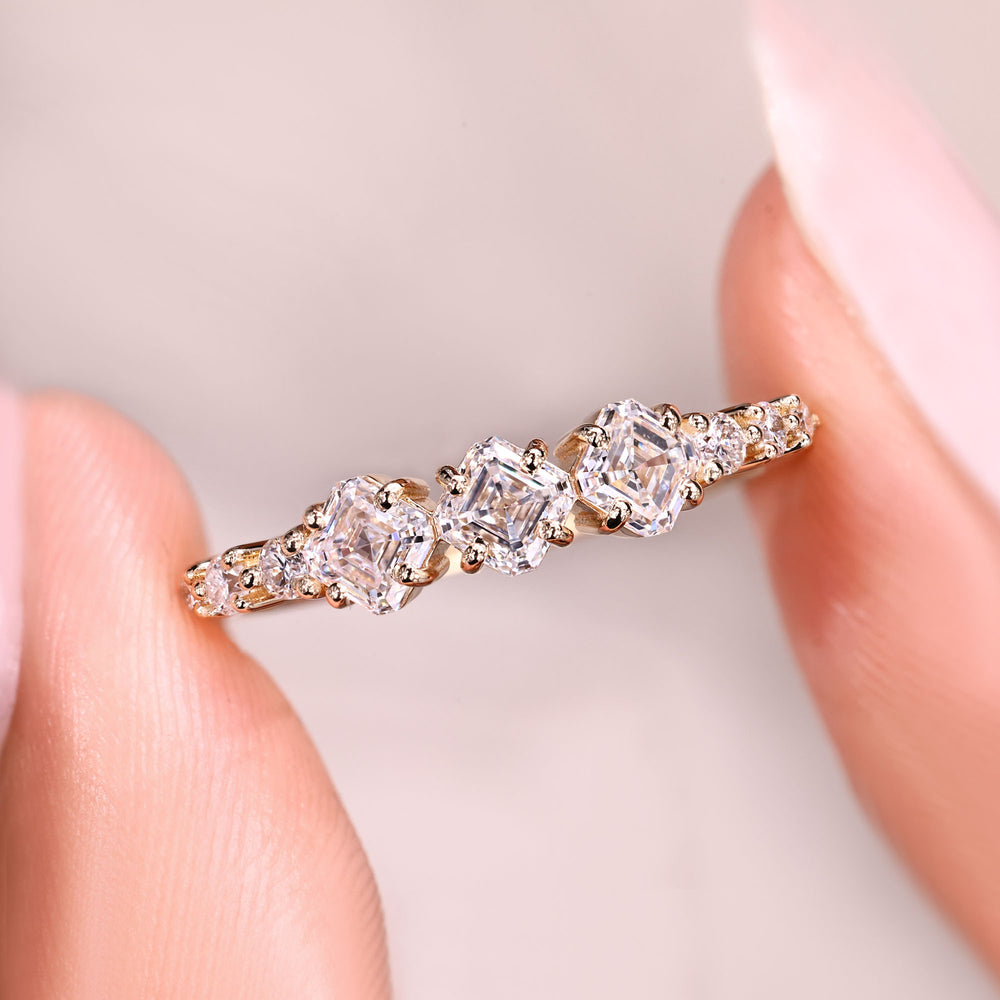 Stackable half eternity band with round diamond accents.
