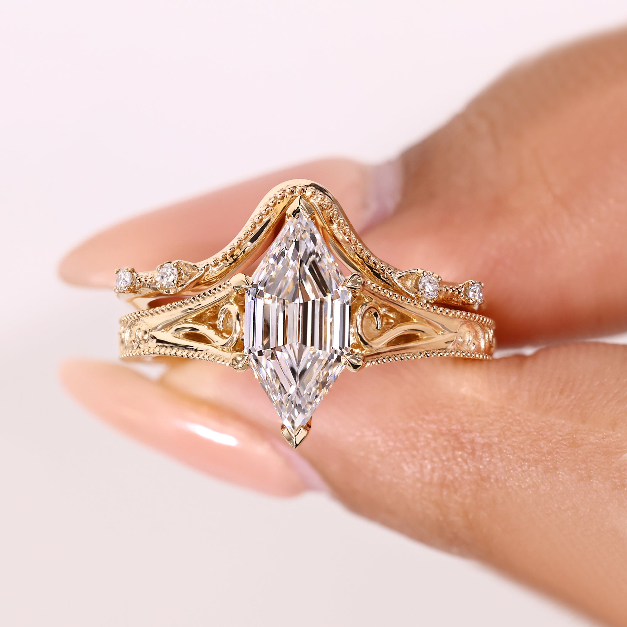 Hexagon diamond ring with milgrain wedding band.
