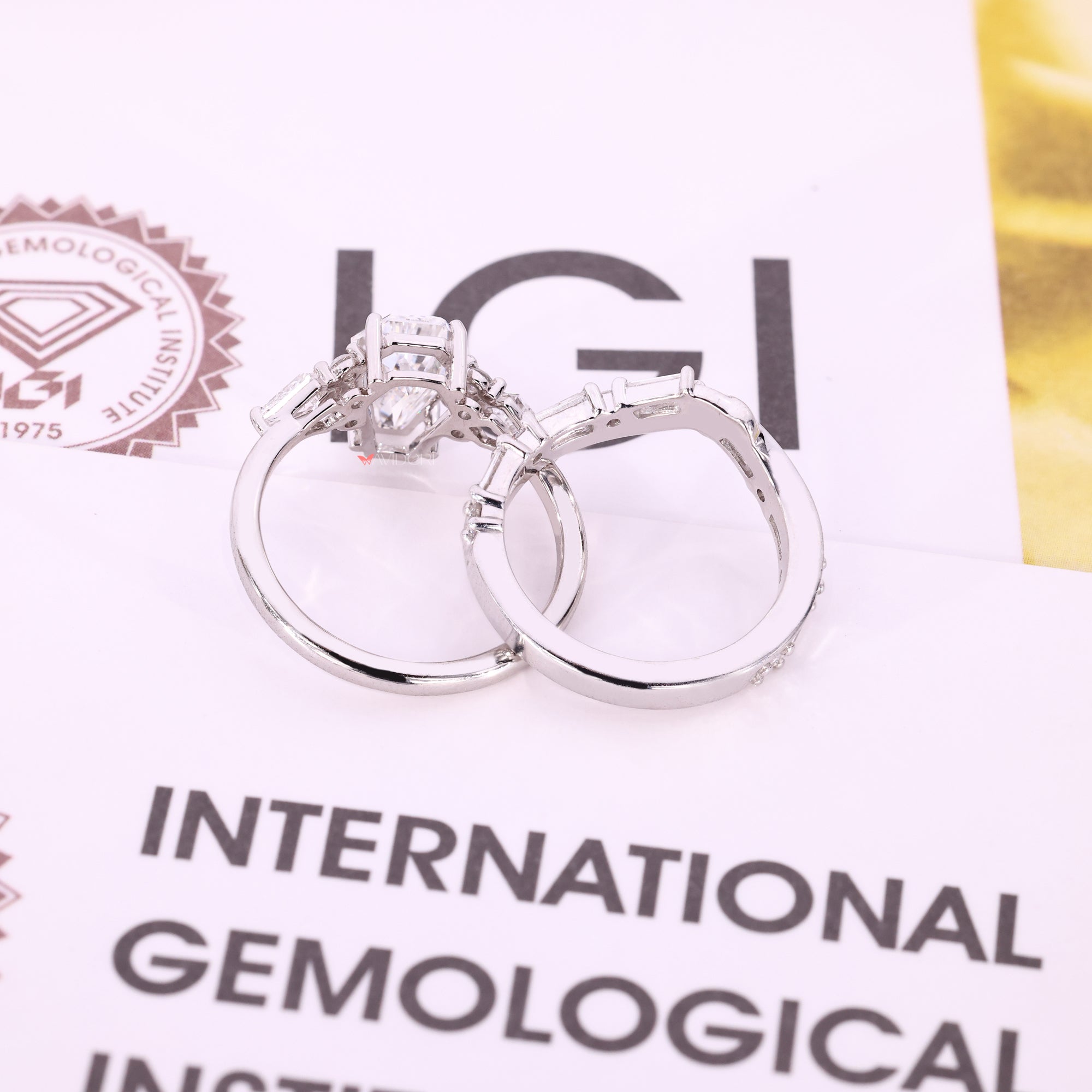 White gold bridal set featuring a baguette cut band.