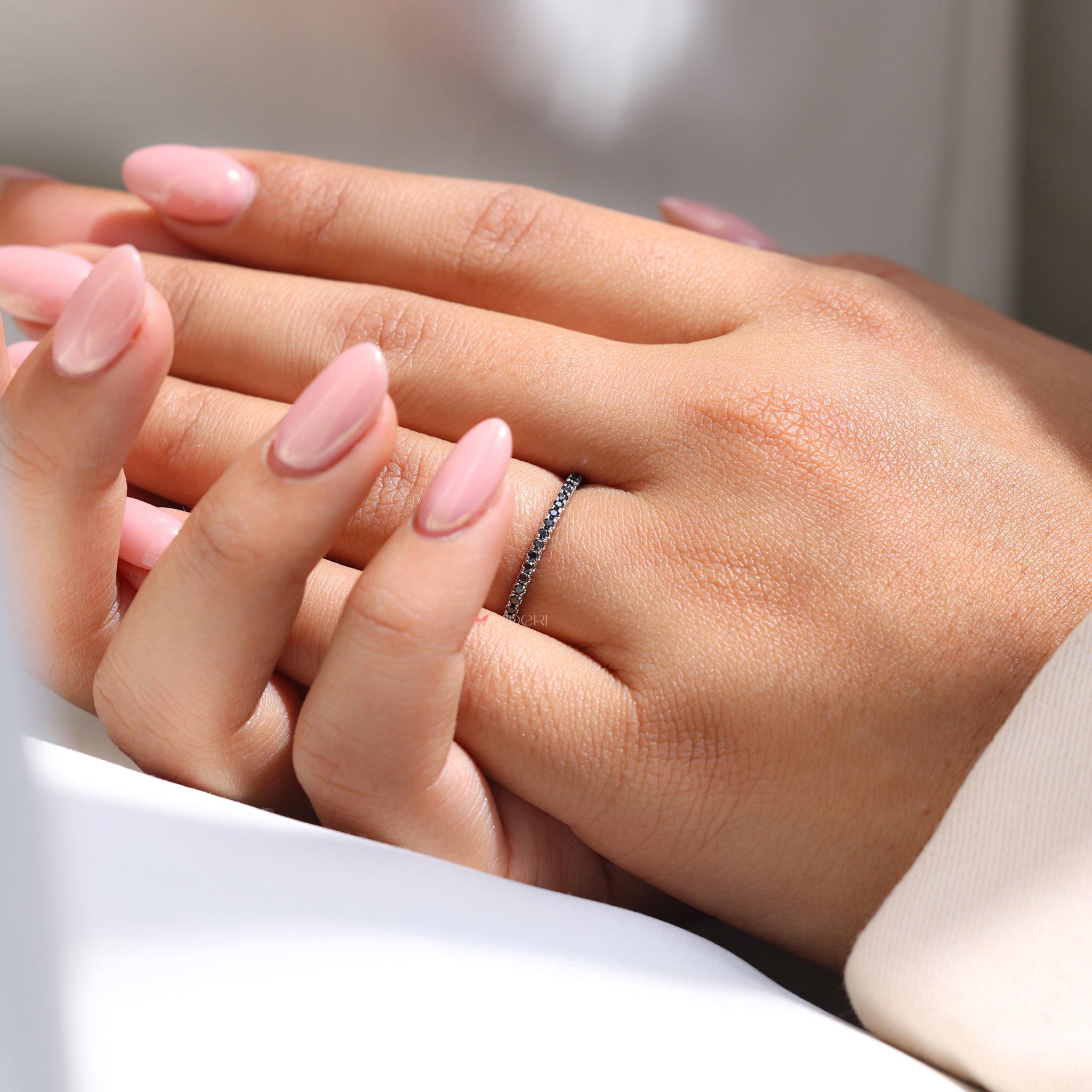 Round eternity band set in a White gold wedding band for elegance.