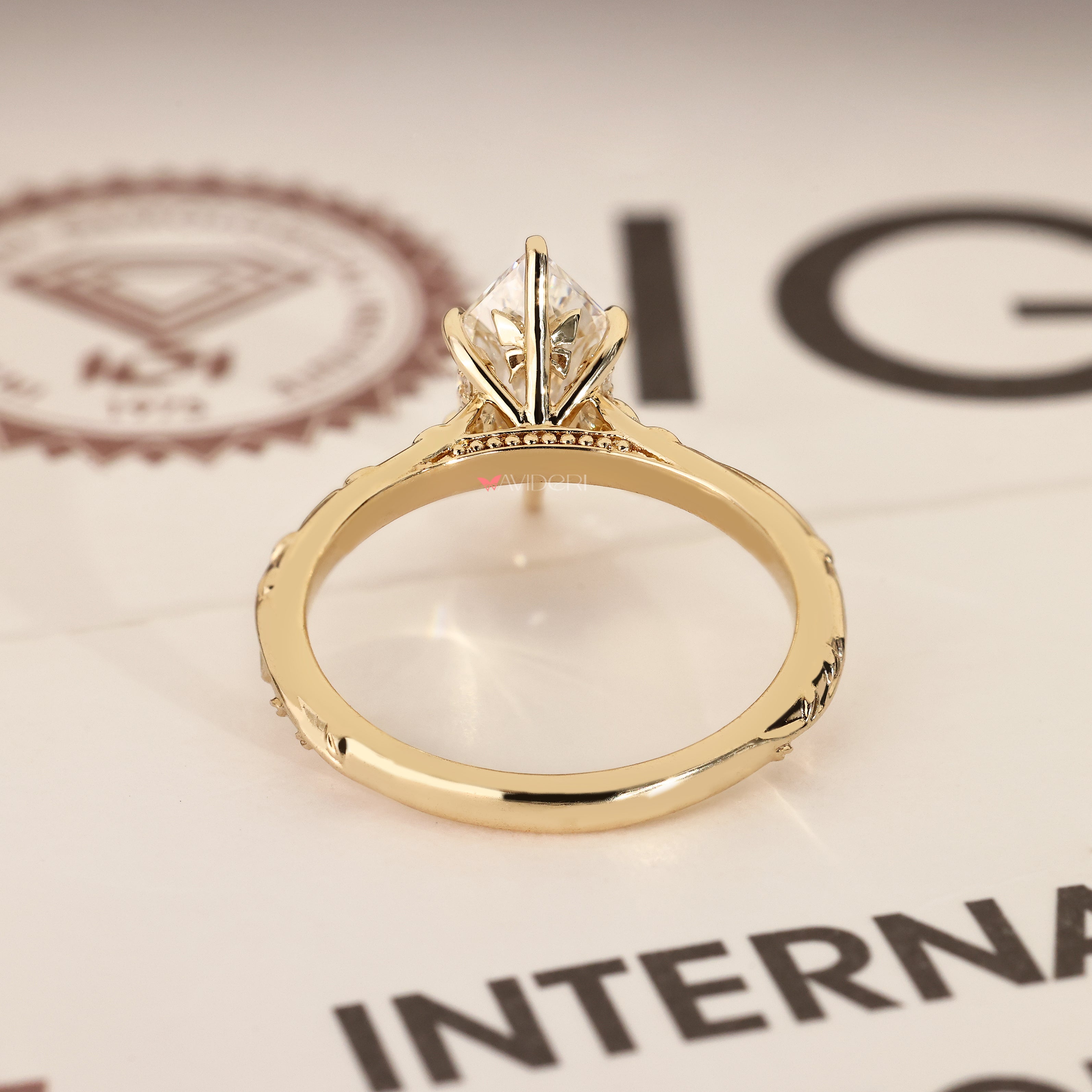 Marquise diamond ring with hidden butterfly style.
