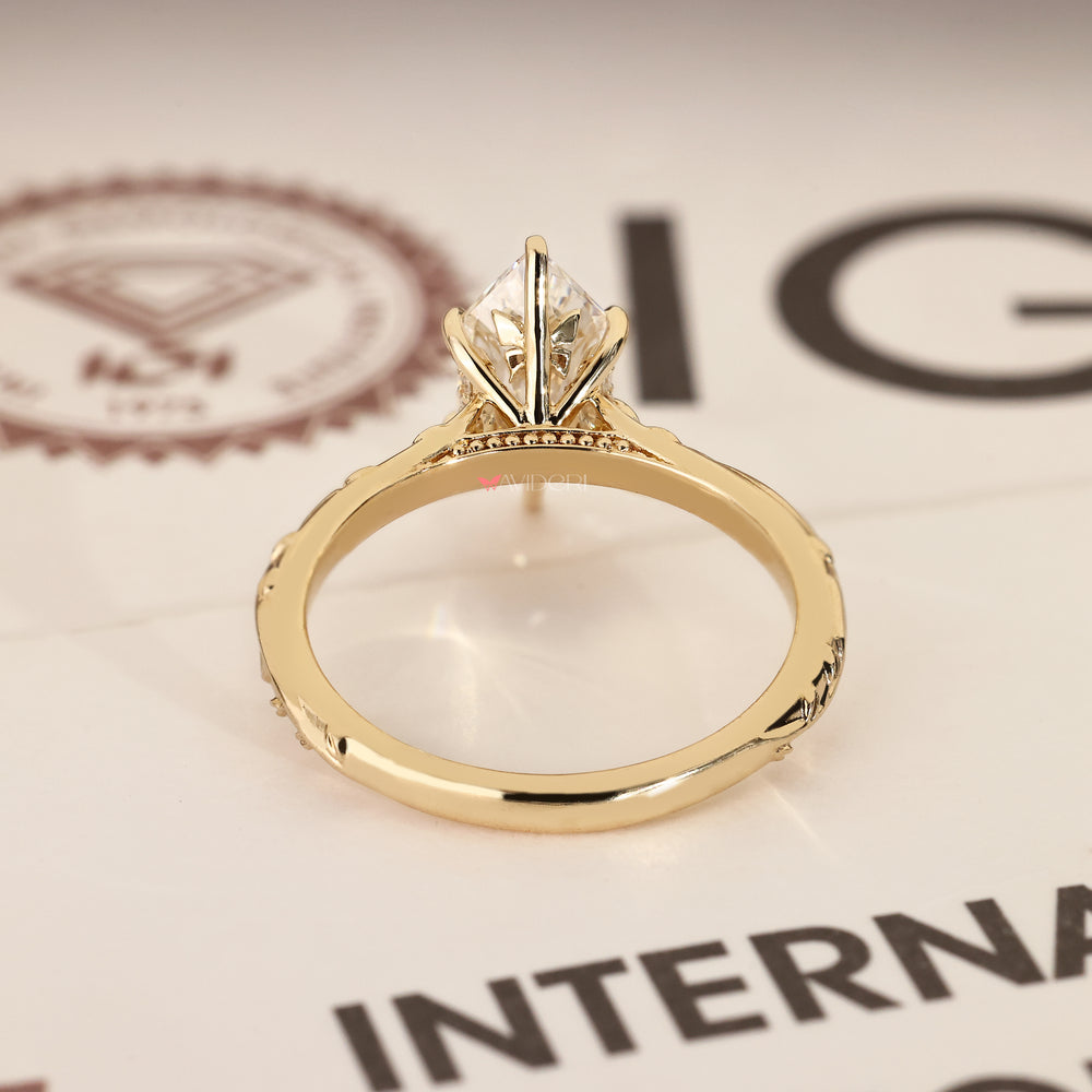 Marquise diamond ring with hidden butterfly style.
