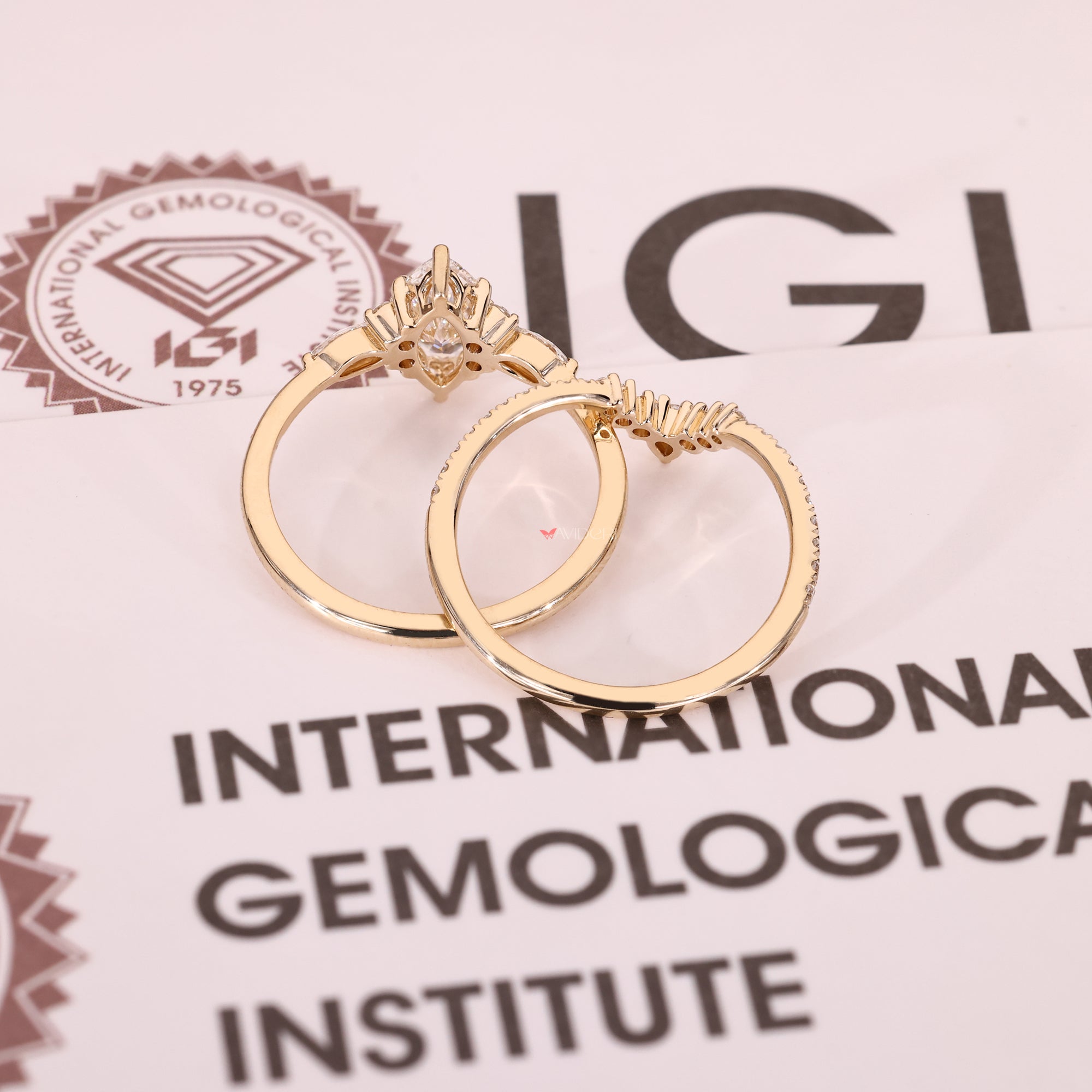 Yellow gold bridal set with a marquise engagement ring.