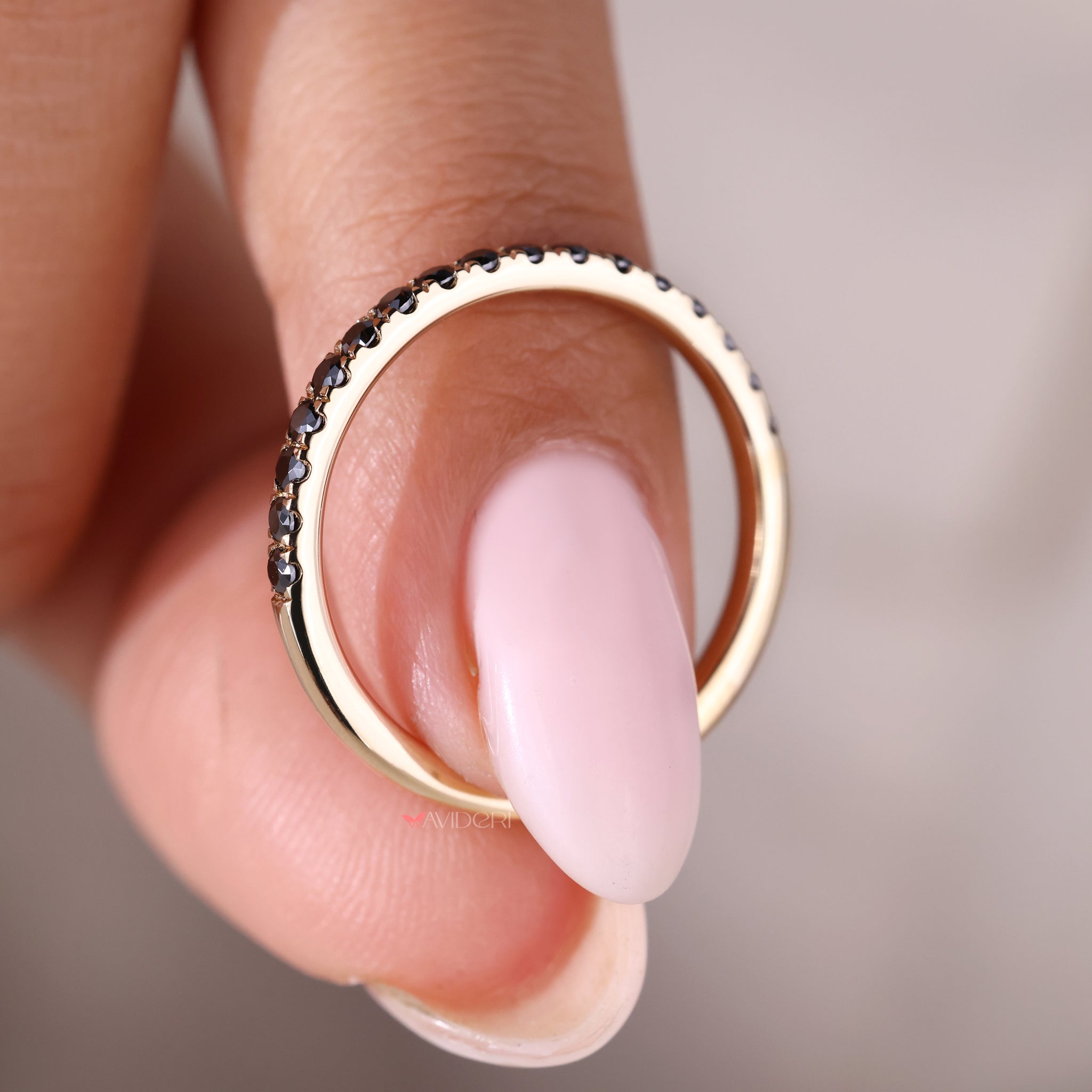 yellow gold band featuring a round eternity band for added sparkle.
