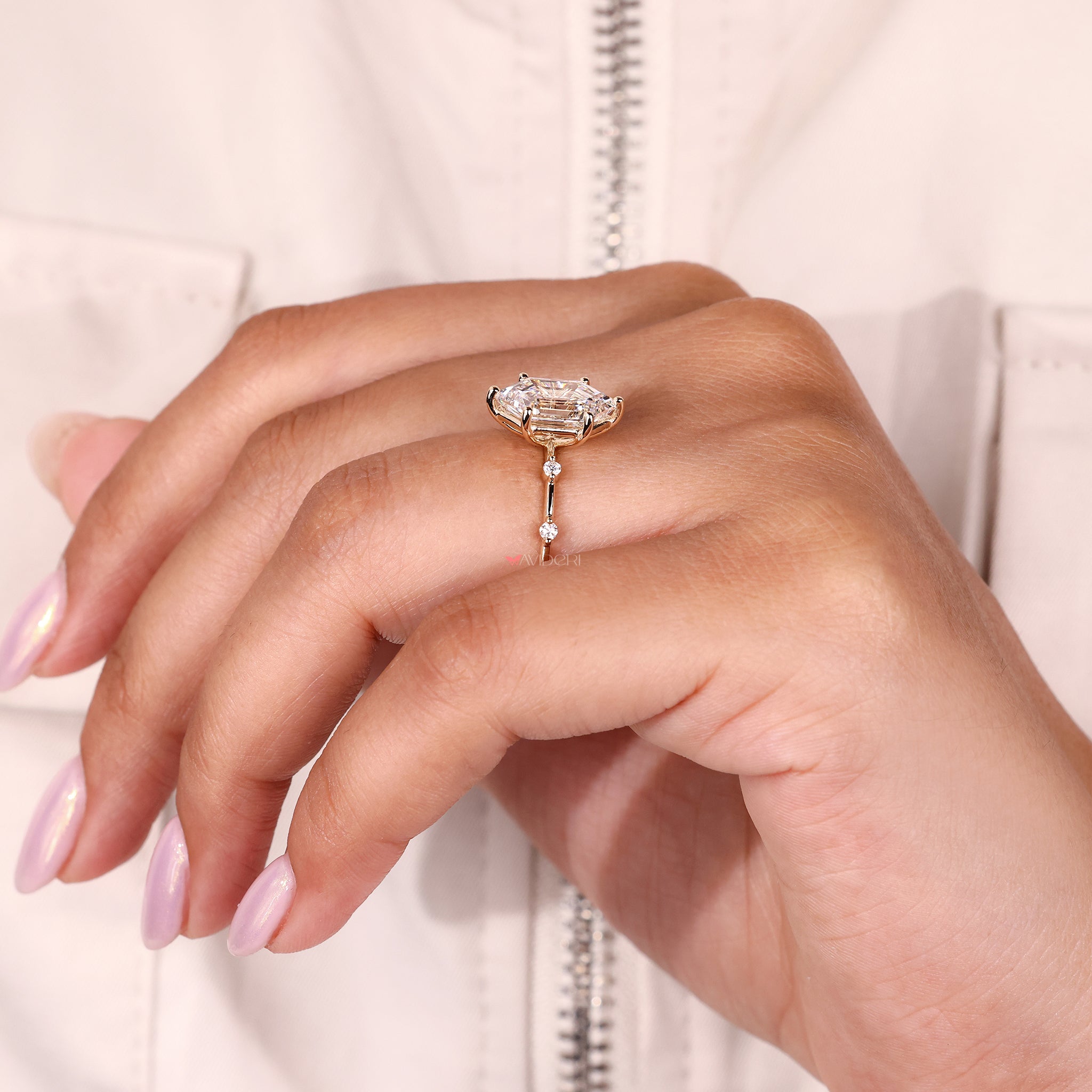 Simple engagement ring featuring hexagon cut and round prong diamonds