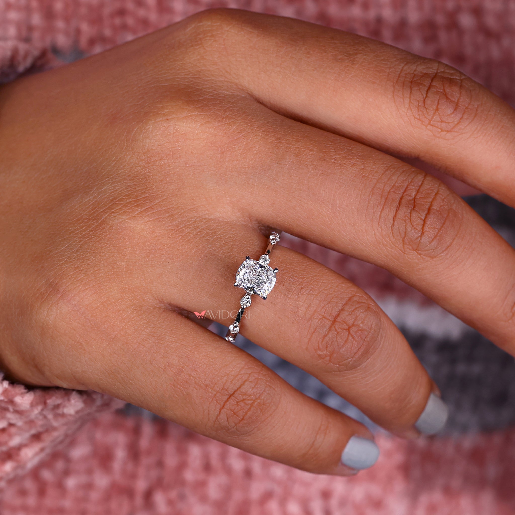 Cushion engagement ring crafted with a Distance Pave Setting and handmade jewelry design for modern elegance.

