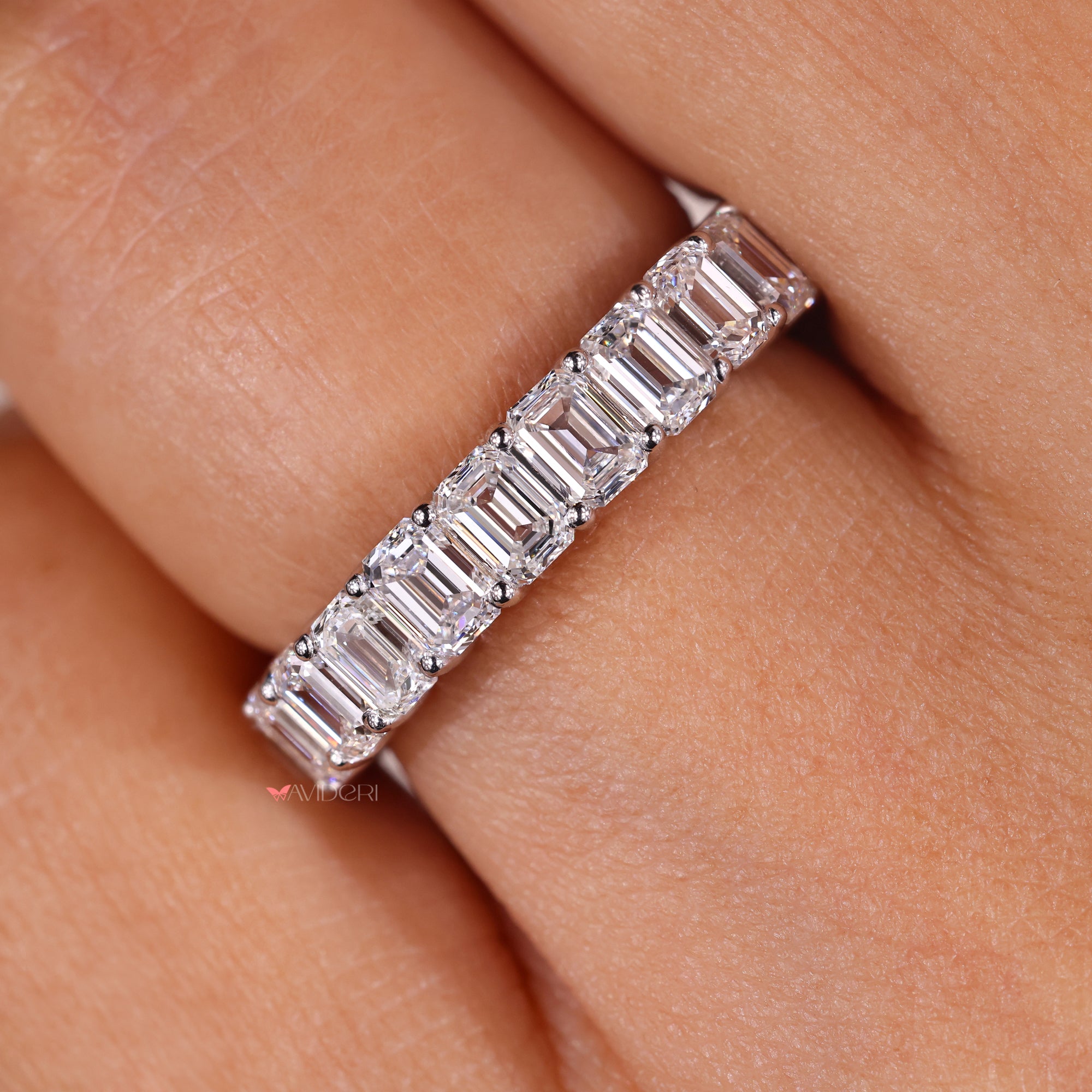 Emerald cut diamond eternity band lab grown.
