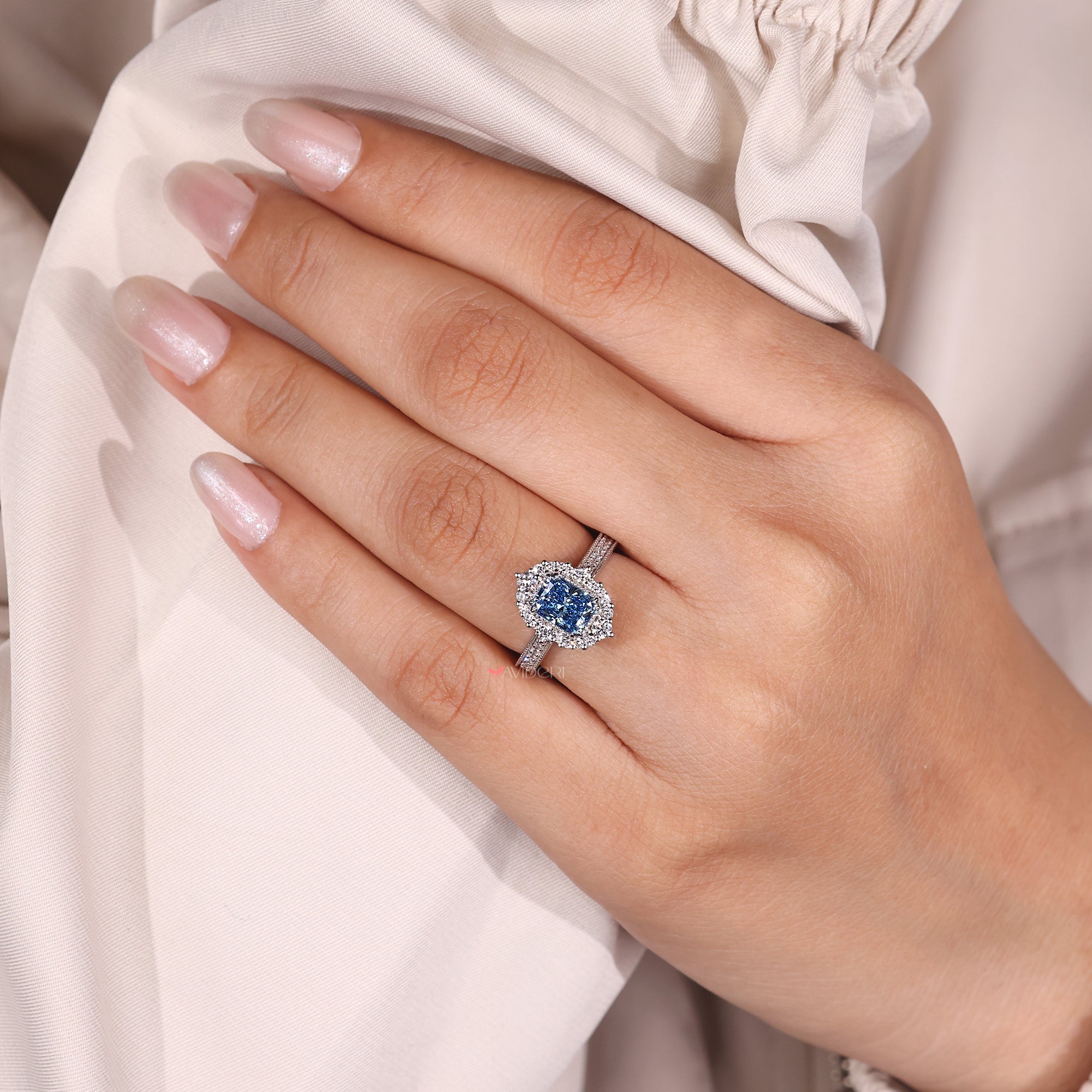 Handmade radiant diamond engagement ring with milgrain design.