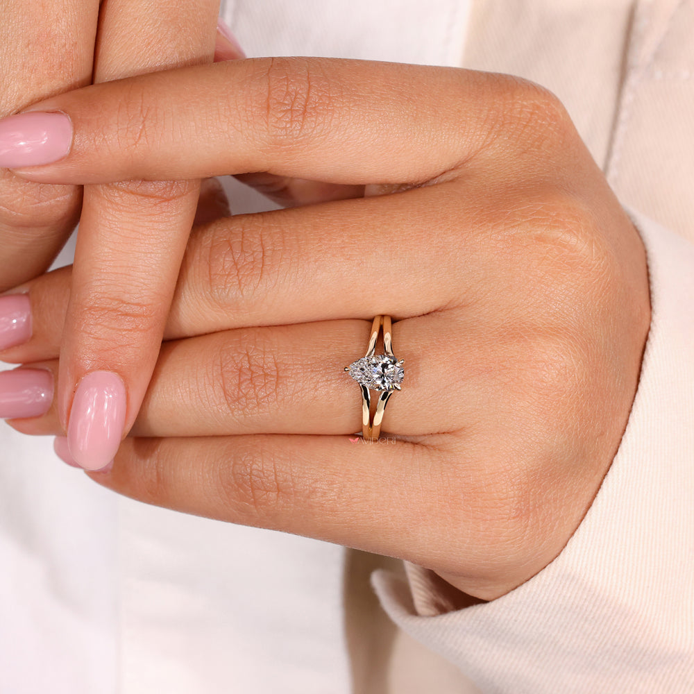Pear cut diamond ring featuring a split shank engagement ring design, handmade with exceptional attention to detail.
