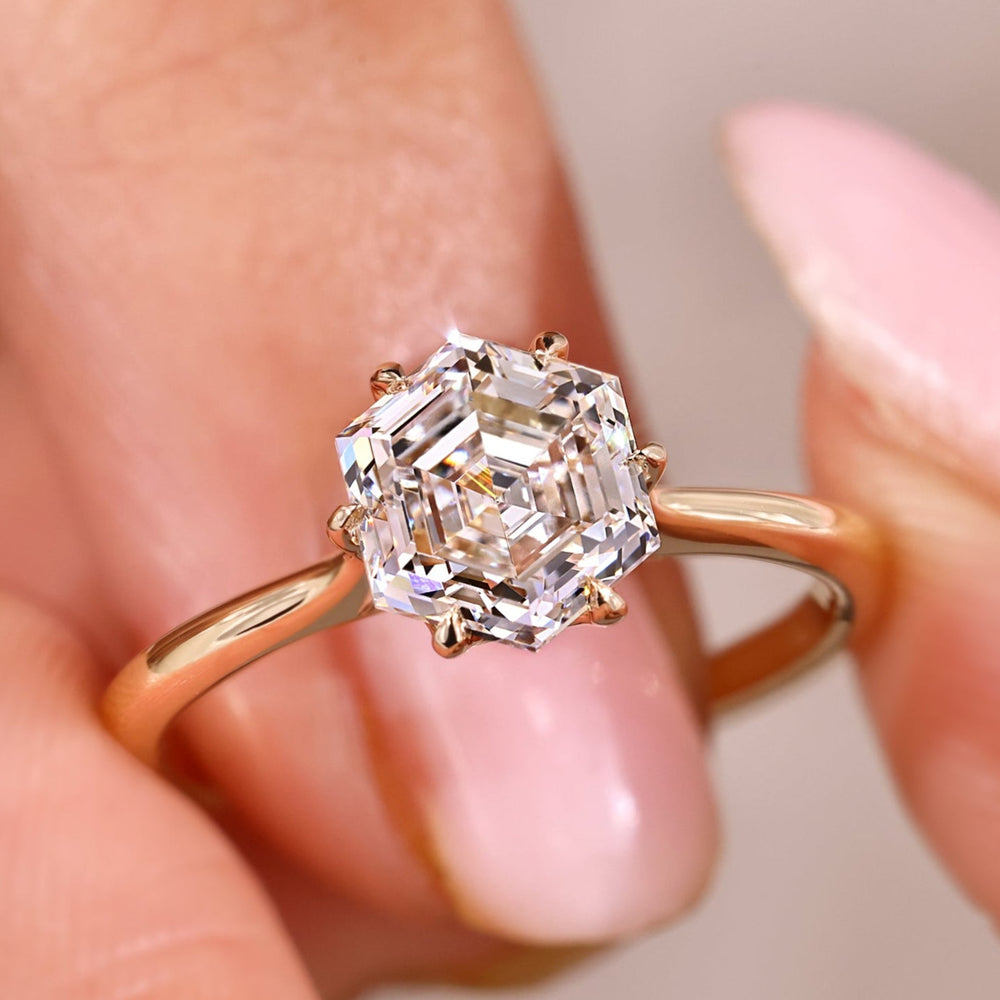 Solitaire engagement ring with hexagon step cut engagement ring.