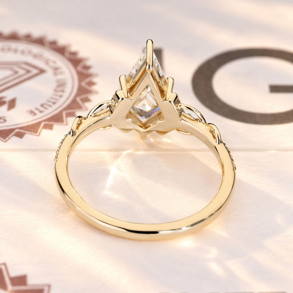 IGI certified kite cut diamond ring with vine detail.

