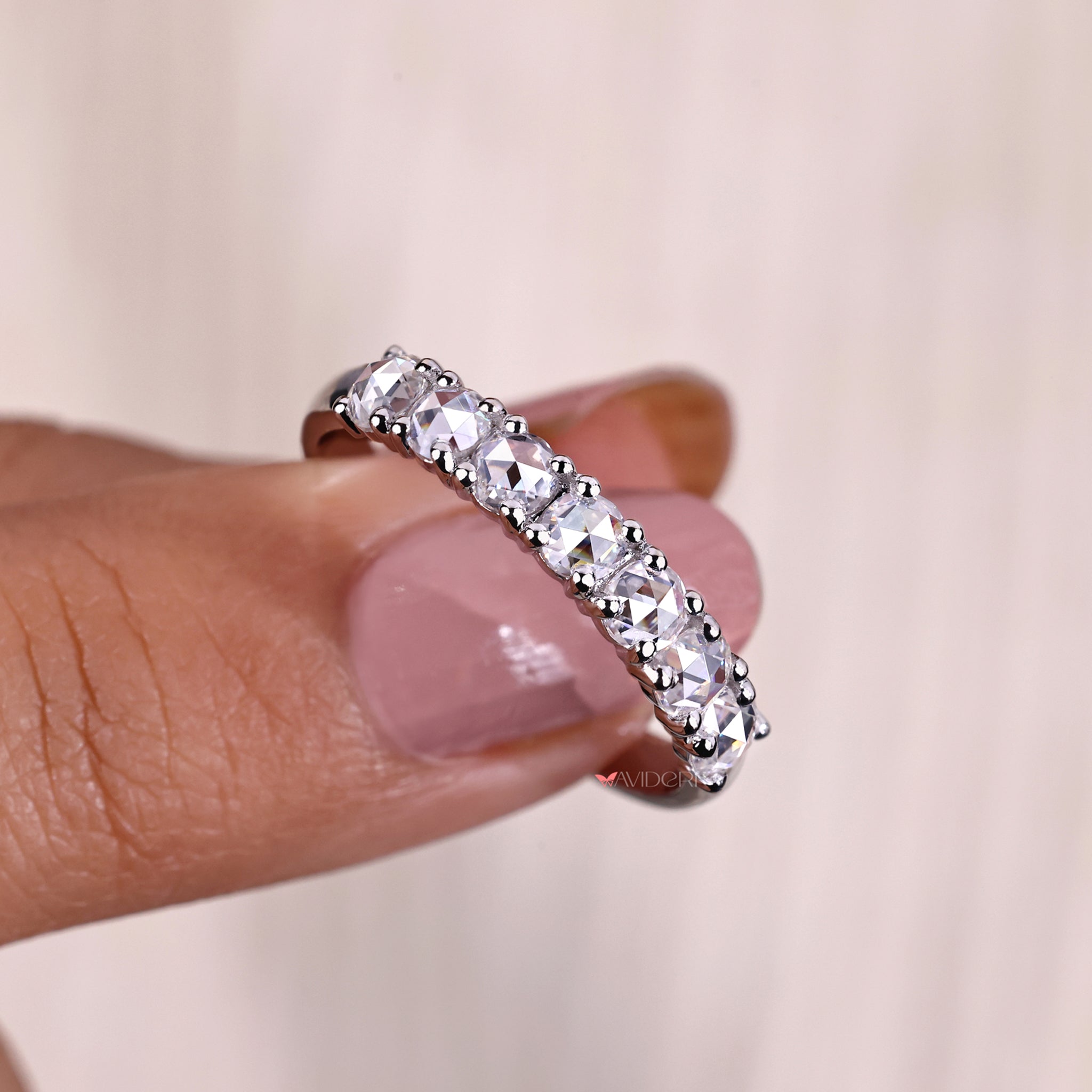 Round Cut Diamond featured in a sleek, contemporary wedding band.
