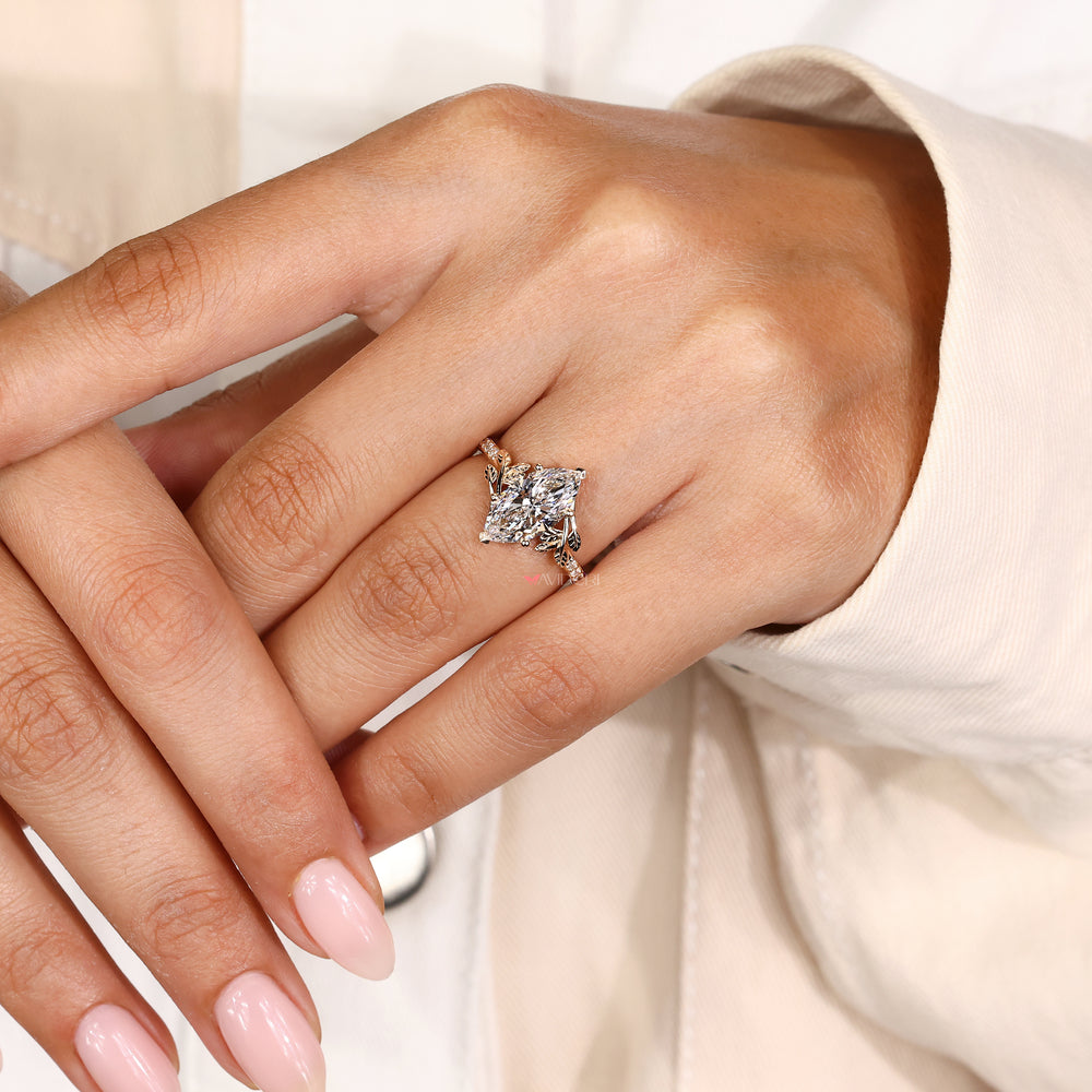 Marquise engagement ring with pave setting and leaf accents
