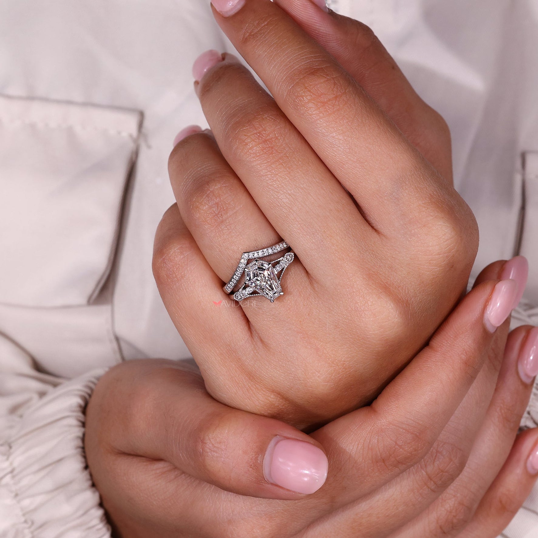 Art deco engagement ring with curved wedding band in a matching bridal set.
