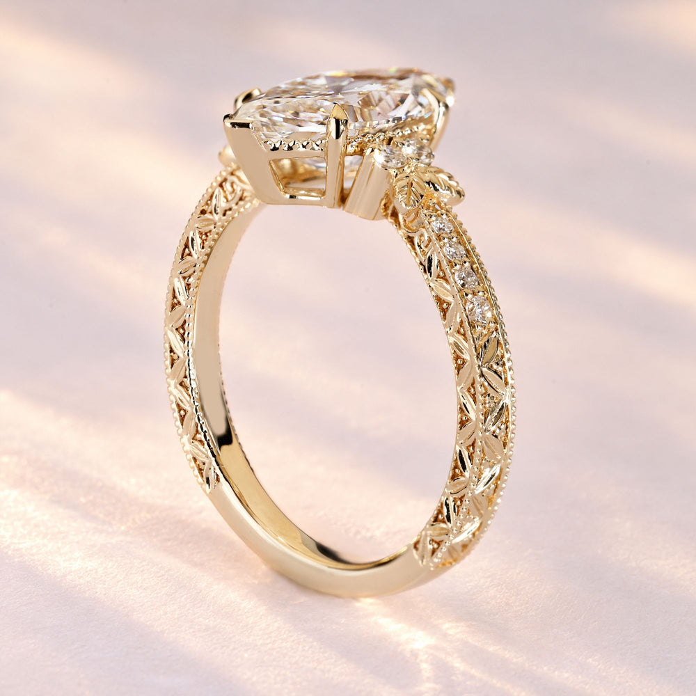 Lab grown marquise diamond ring with milgrain.
