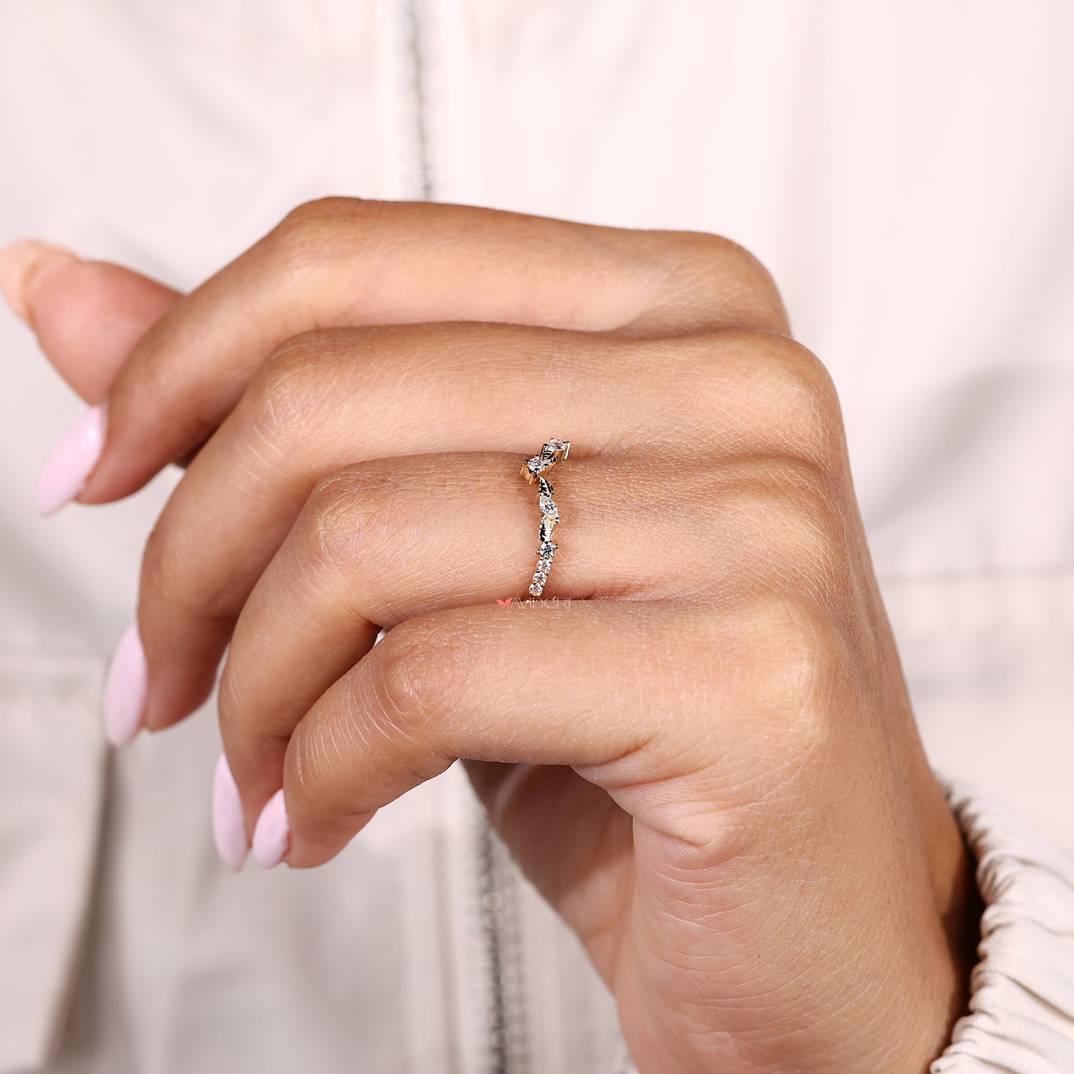 Diamond wedding band with marquise stones and curved shape
