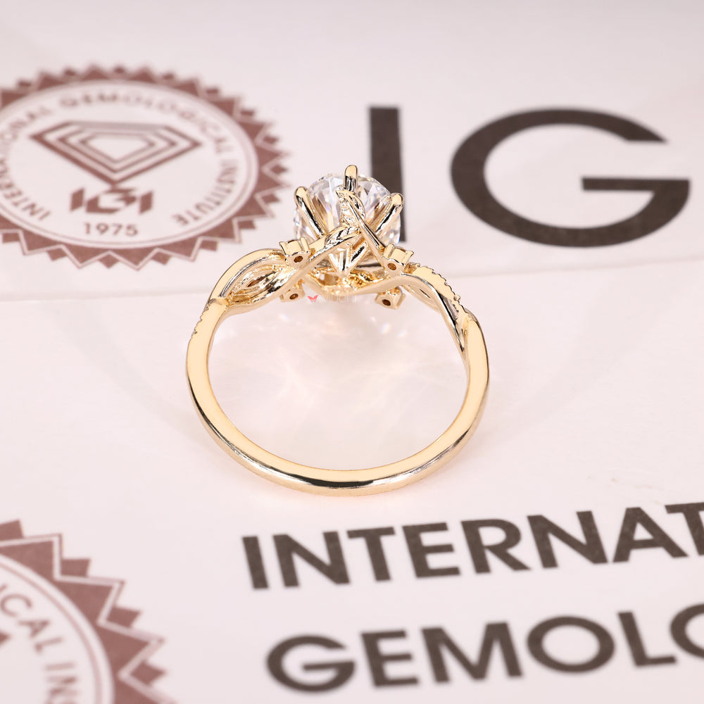 Oval engagement ring with pavé band and marquise side stones

