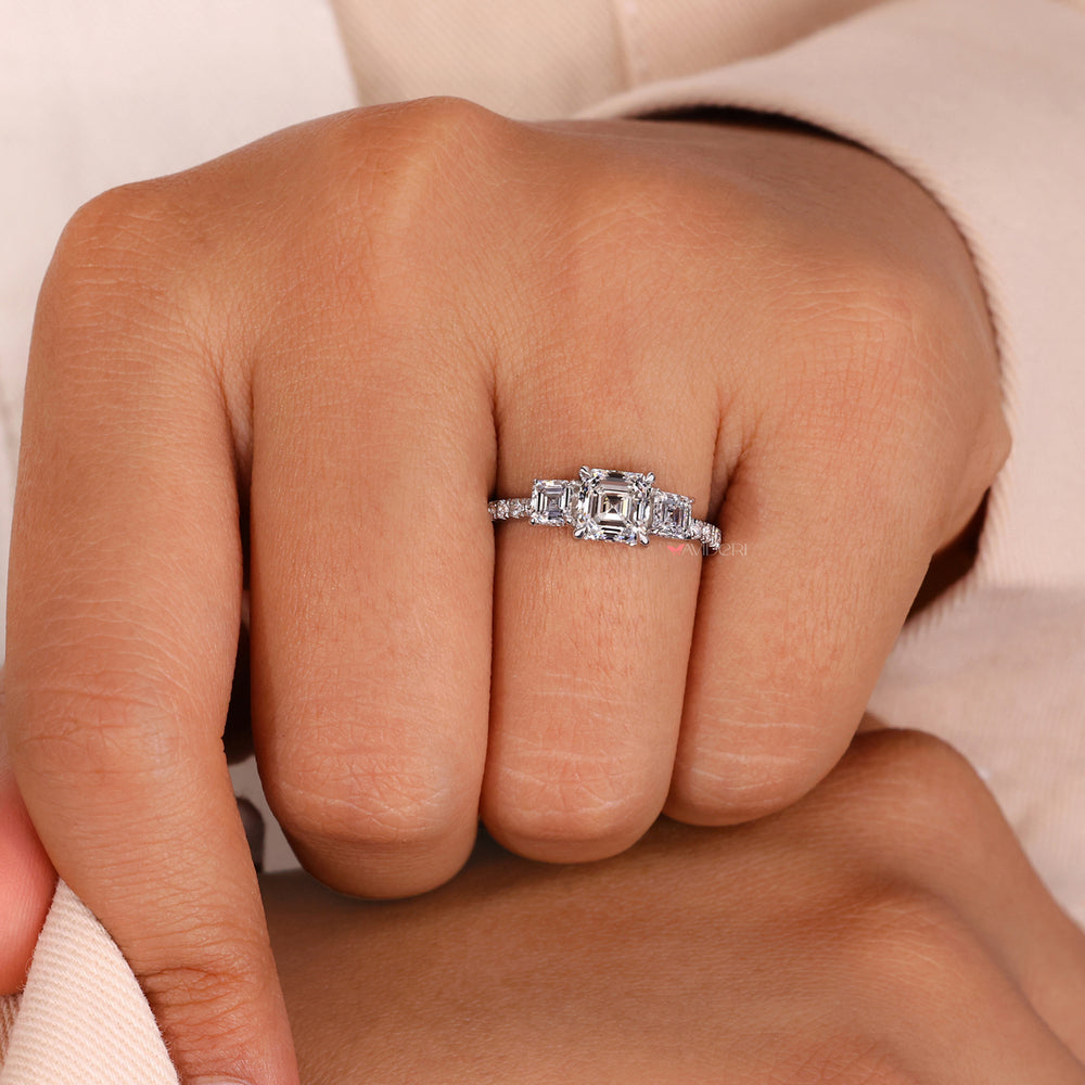 Three stone princess cut engagement ring with a 4 prong diamond ring.
