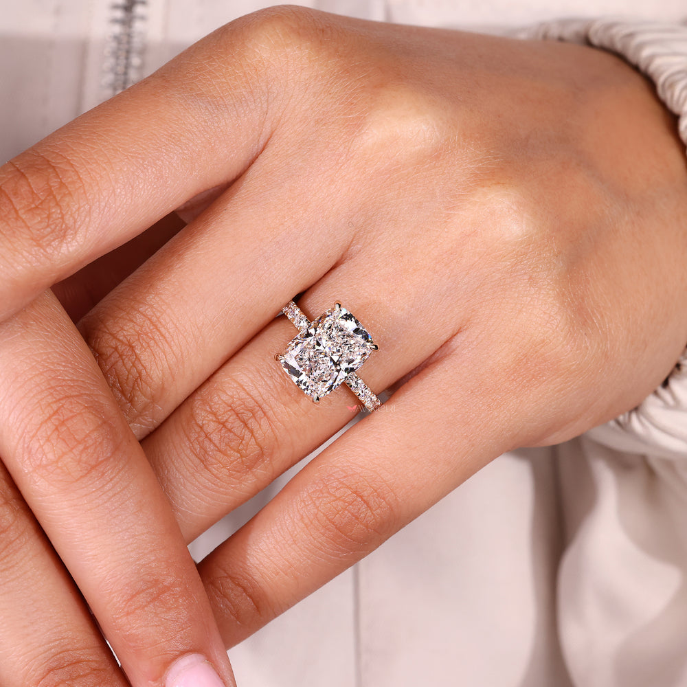 Cushion cut lab grown diamond ring with four prong setting.
