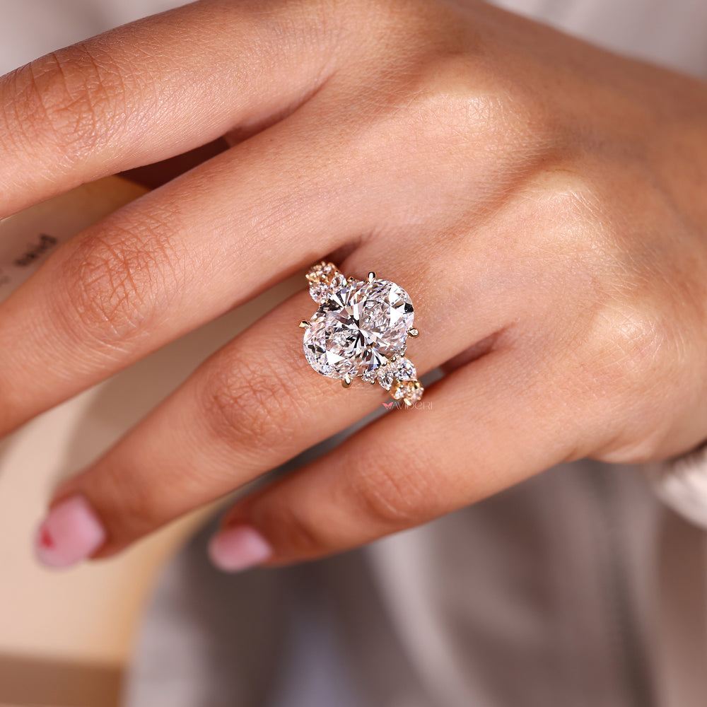 Oval cut lab grown diamond ring in cluster setting.
