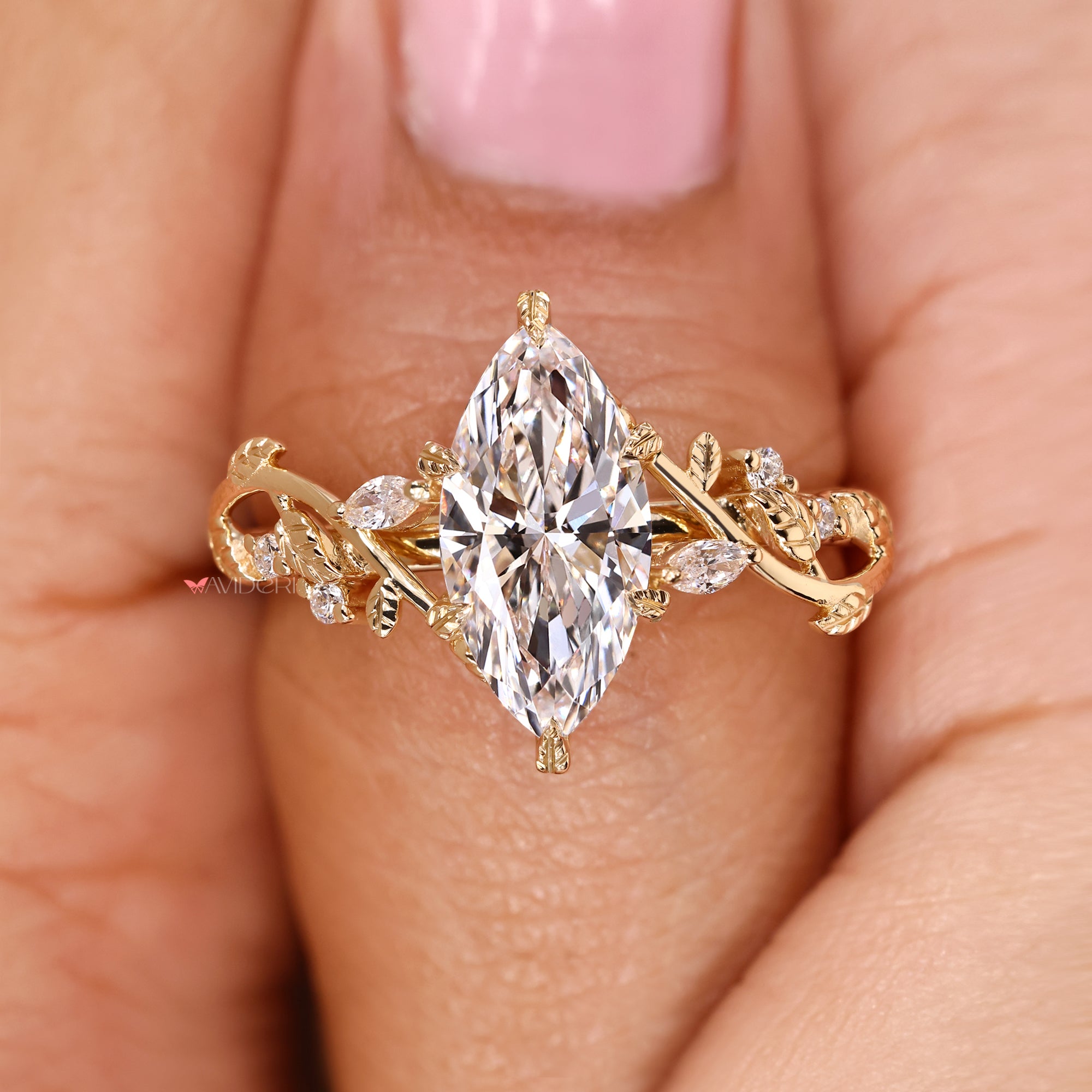 Marquise cut diamond ring with leaf style prong setting.
