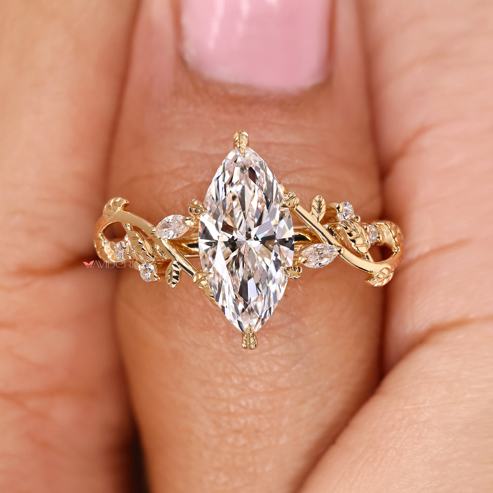 Marquise cut diamond ring with leaf style prong setting.
