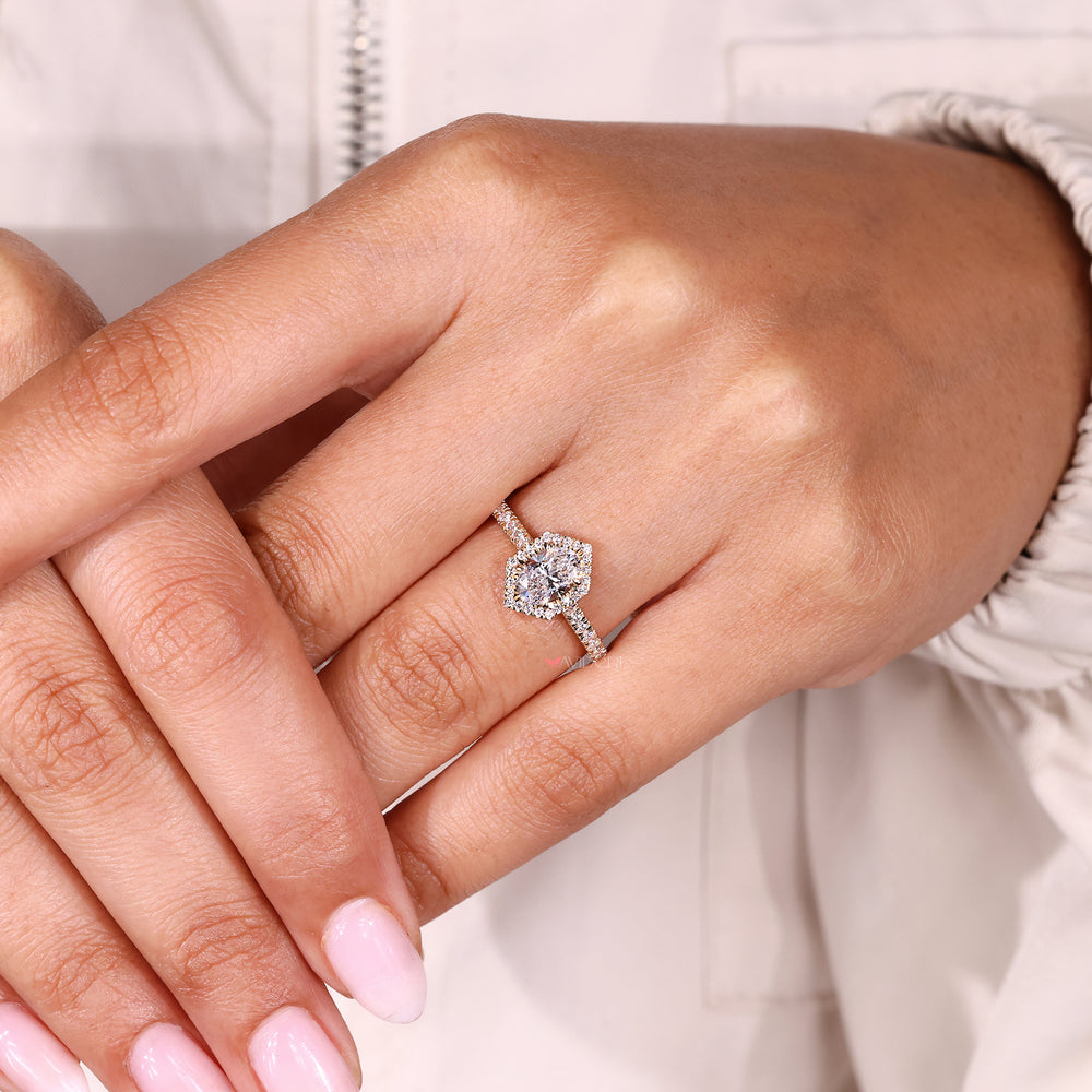 Handmade oval diamond ring with halo style.

