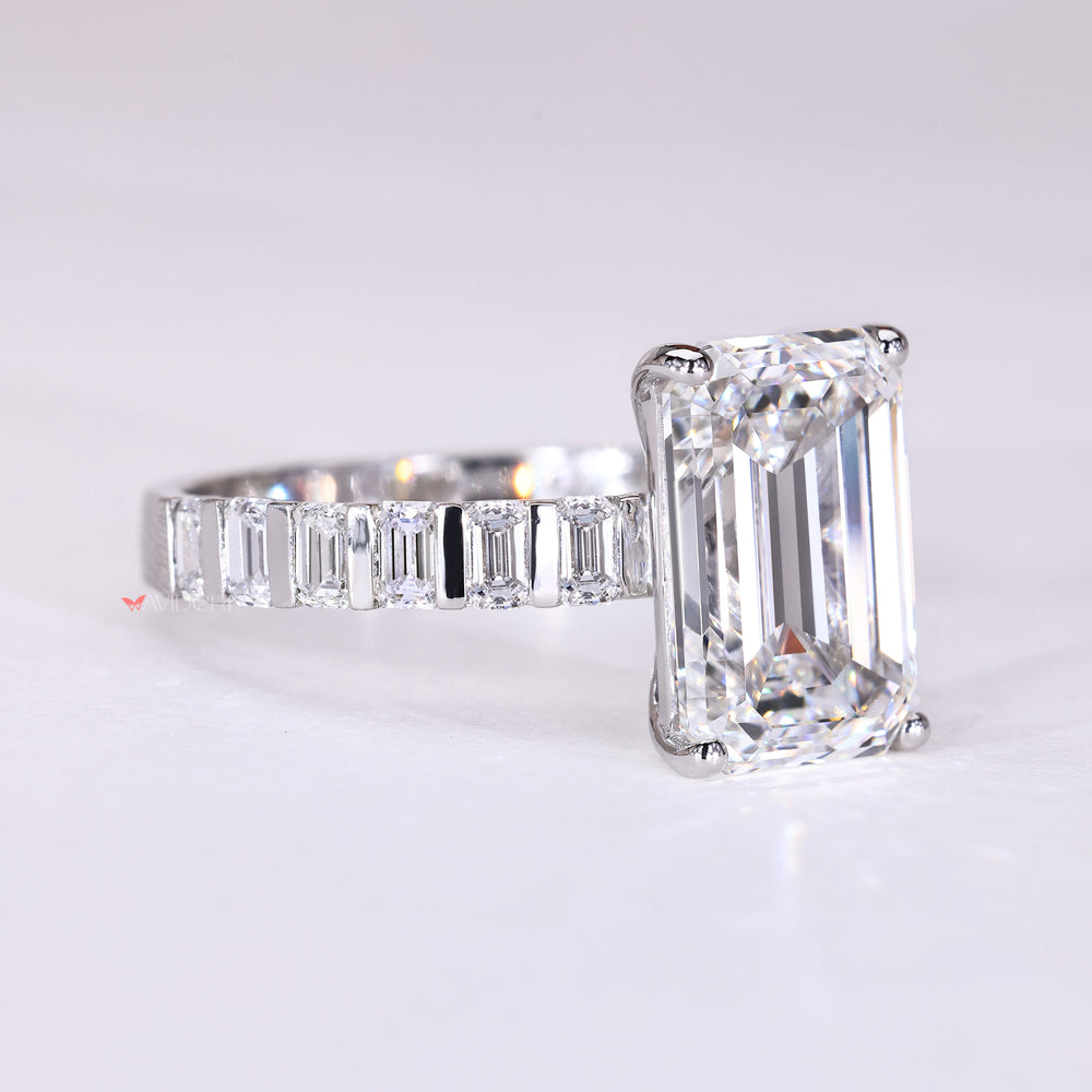 Emerald cut engagement ring with bar set emerald diamonds
