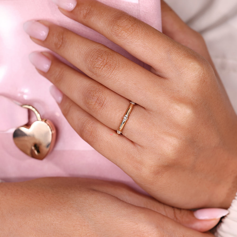 Diamond band with round cut stones prong set.
