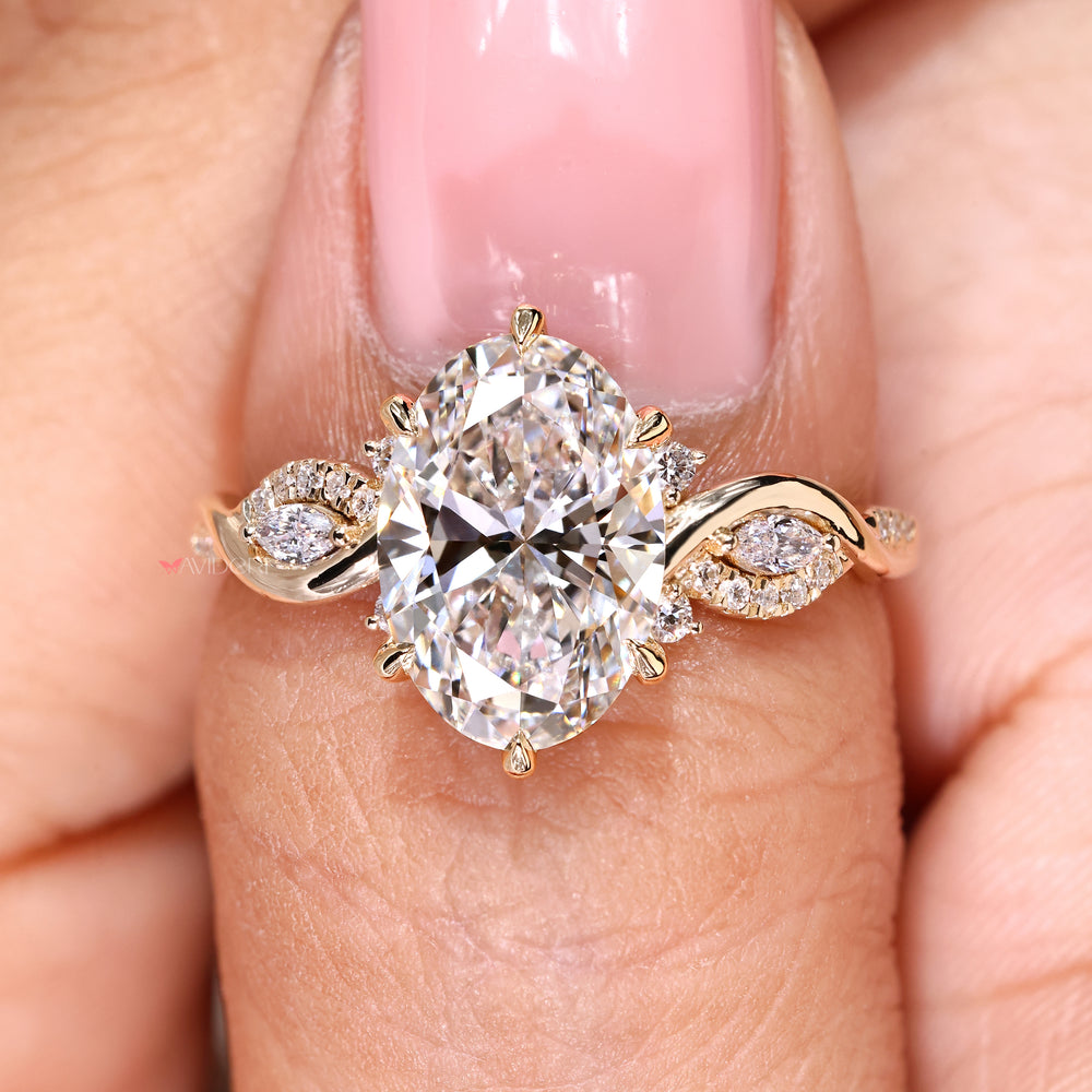 Avideri oval diamond ring with marquise side stone design
