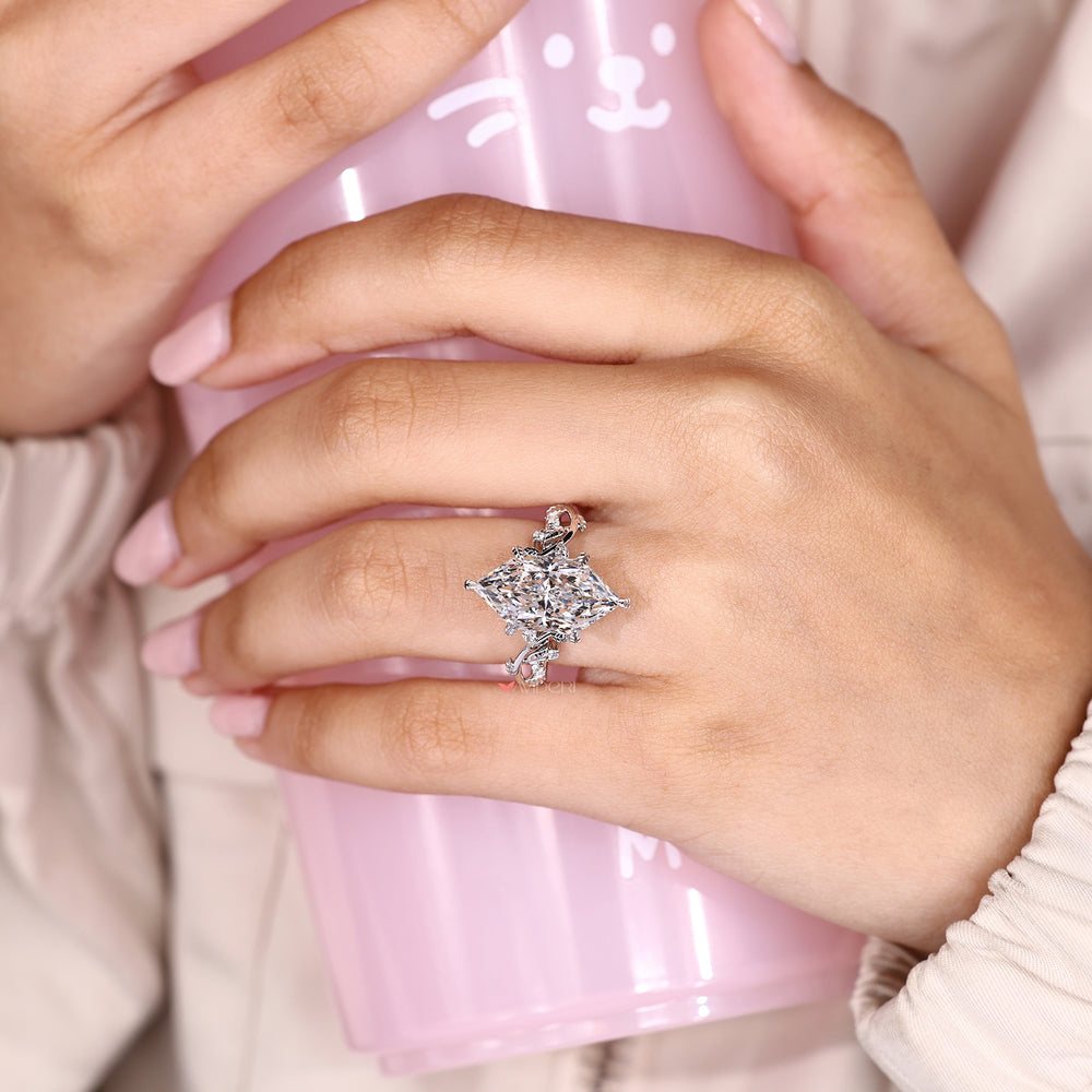 Marquise ring with round side stones design.
