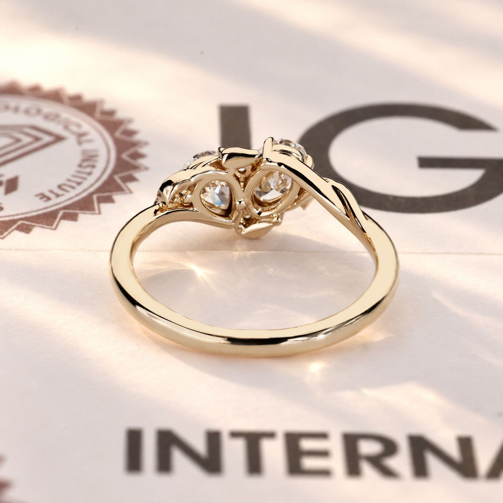 Handmade toi et moi ring with leaf style prongs.

