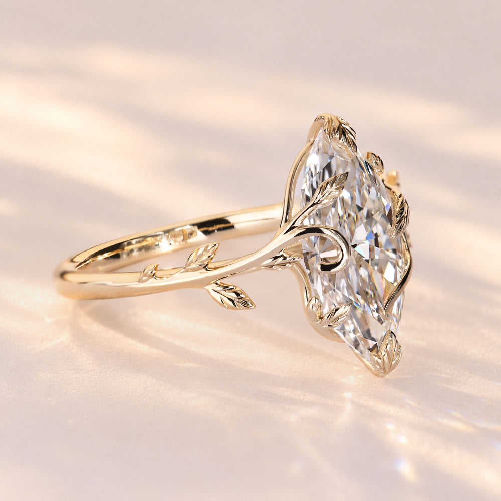 Marquise solitaire ring with leaf prong setting.
