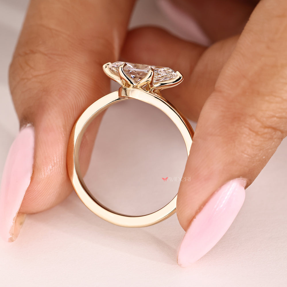 Handmade marquise engagement ring with six claw prong setting
