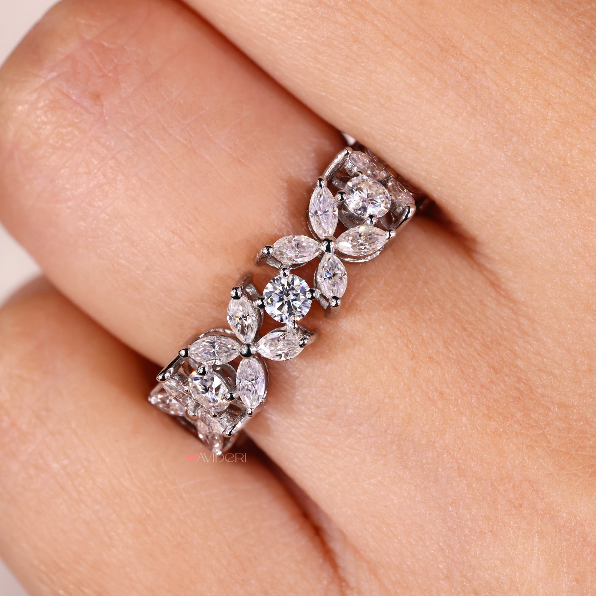 The Moissanite gold wedding band combines warmth and shine.