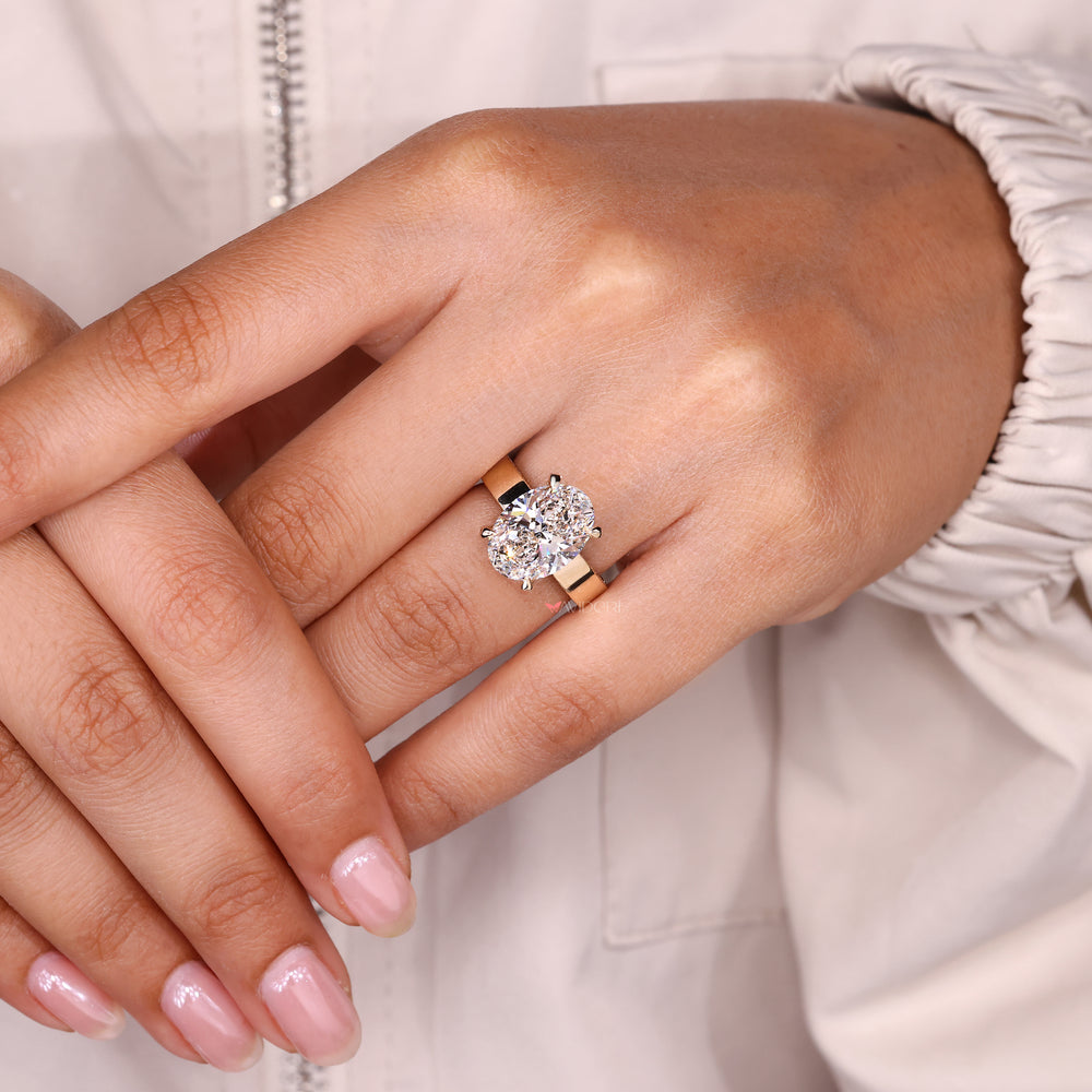 Handmade oval diamond ring hidden halo style.
