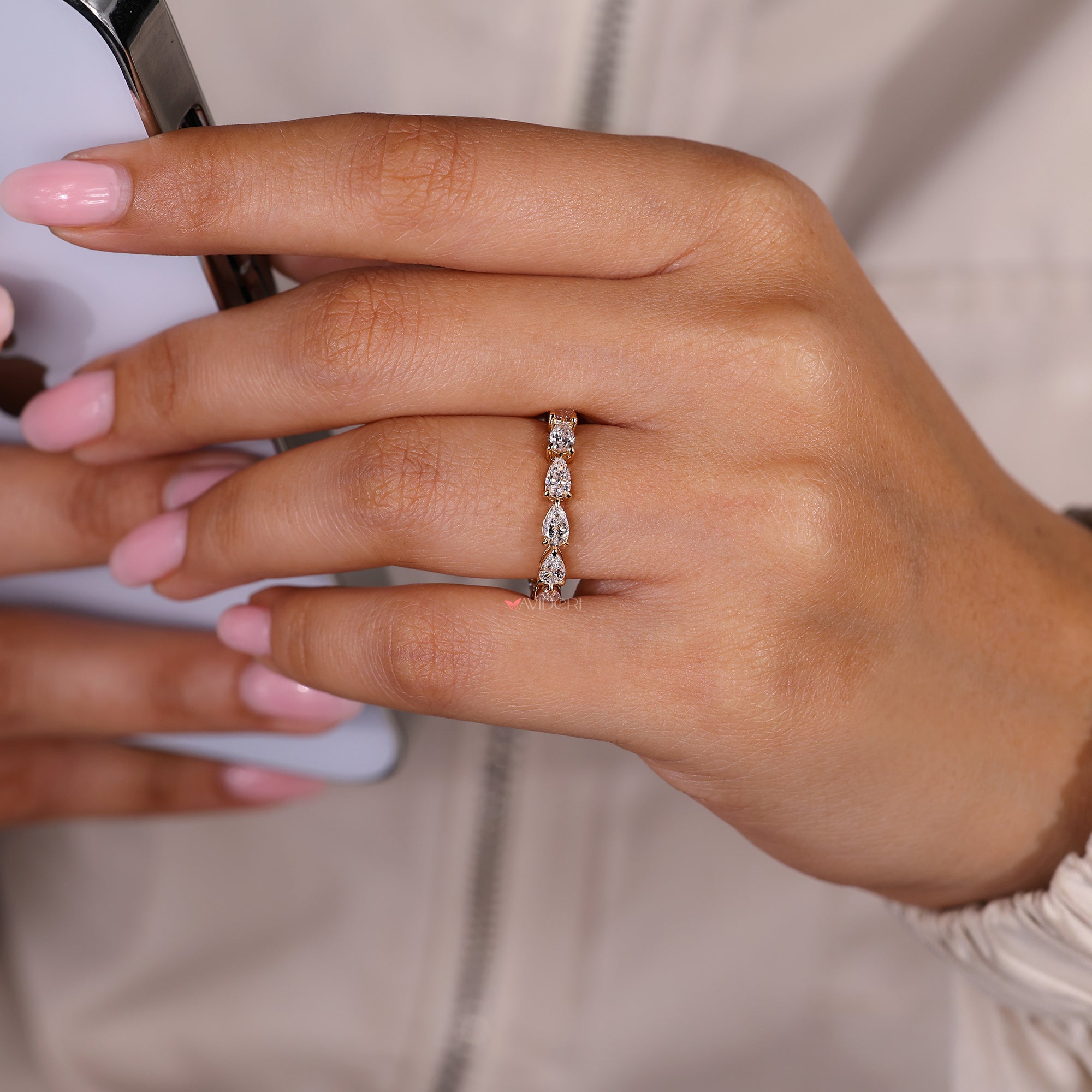 Pear cut diamond full eternity band with stackable style.
