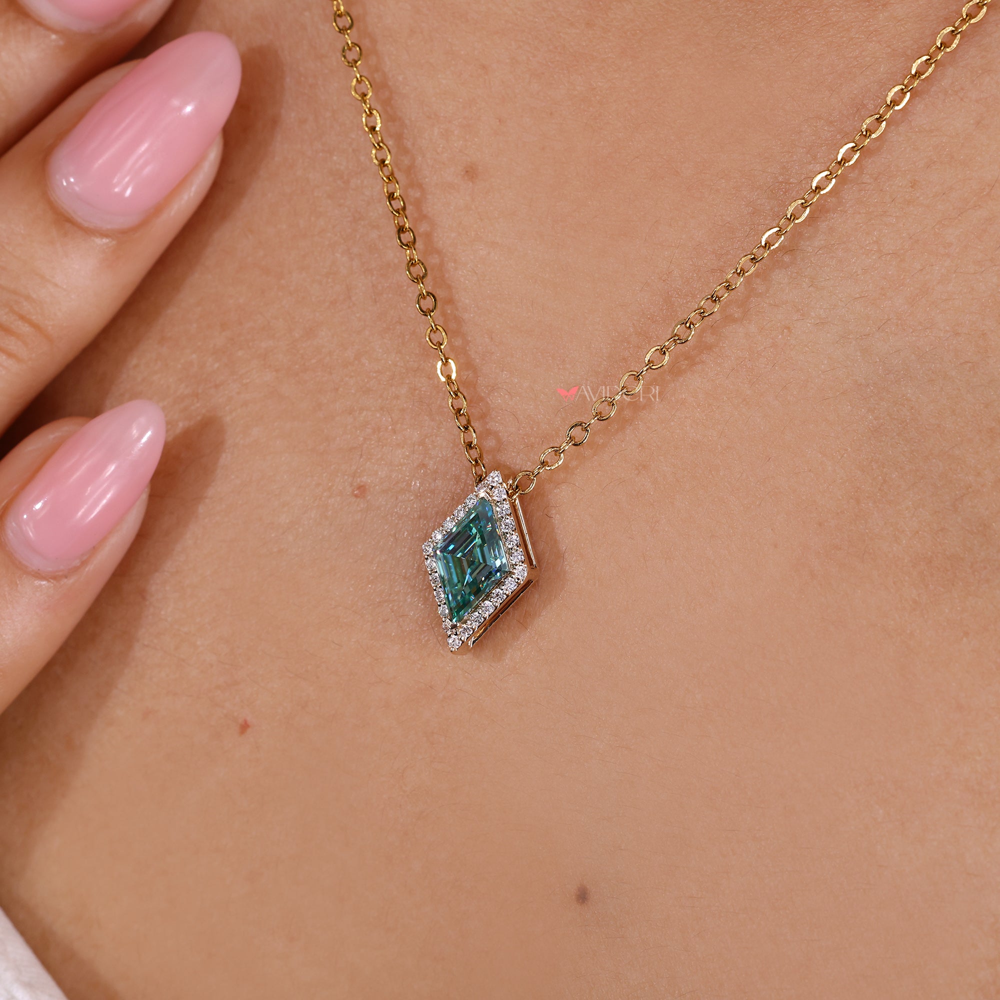 Halo pendant with cyan blue center stone.
