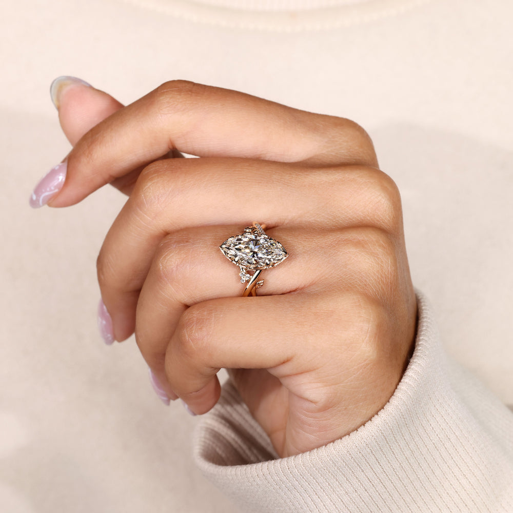 Marquise diamond ring with filigree basket setting.
