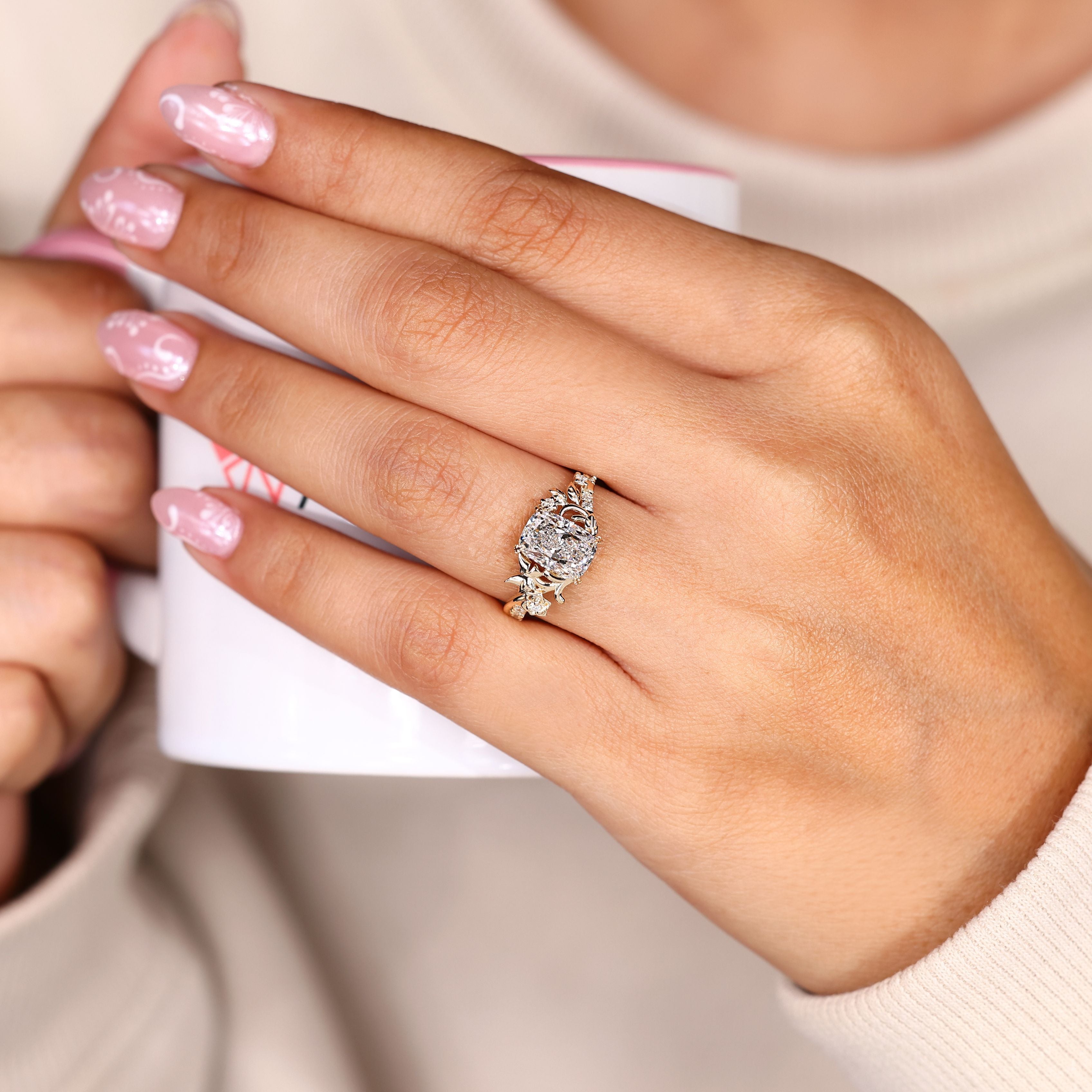 Cushion ring with signature butterfly style detail.
