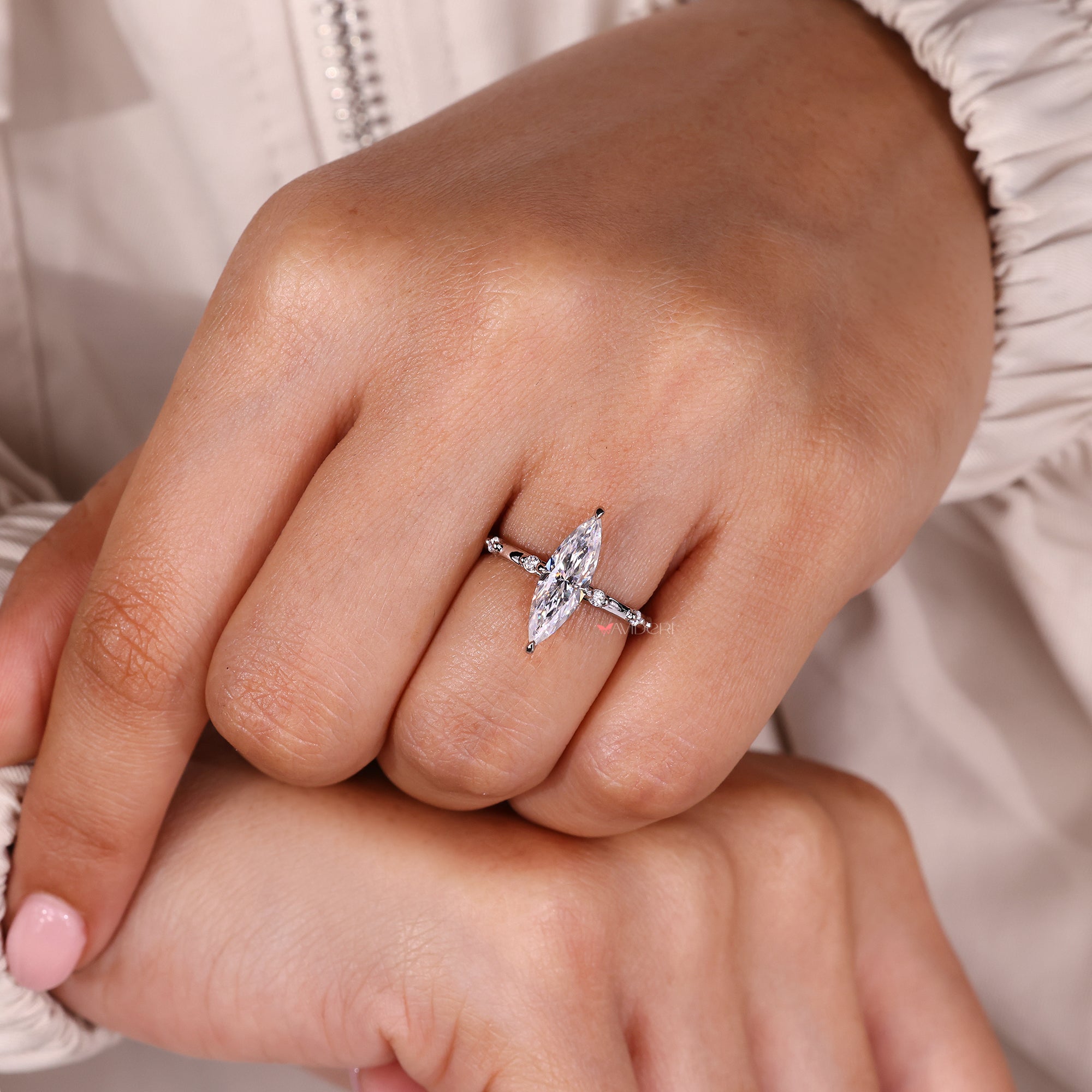 Distance pave setting enhances brilliance while maintaining a soft, refined appearance.