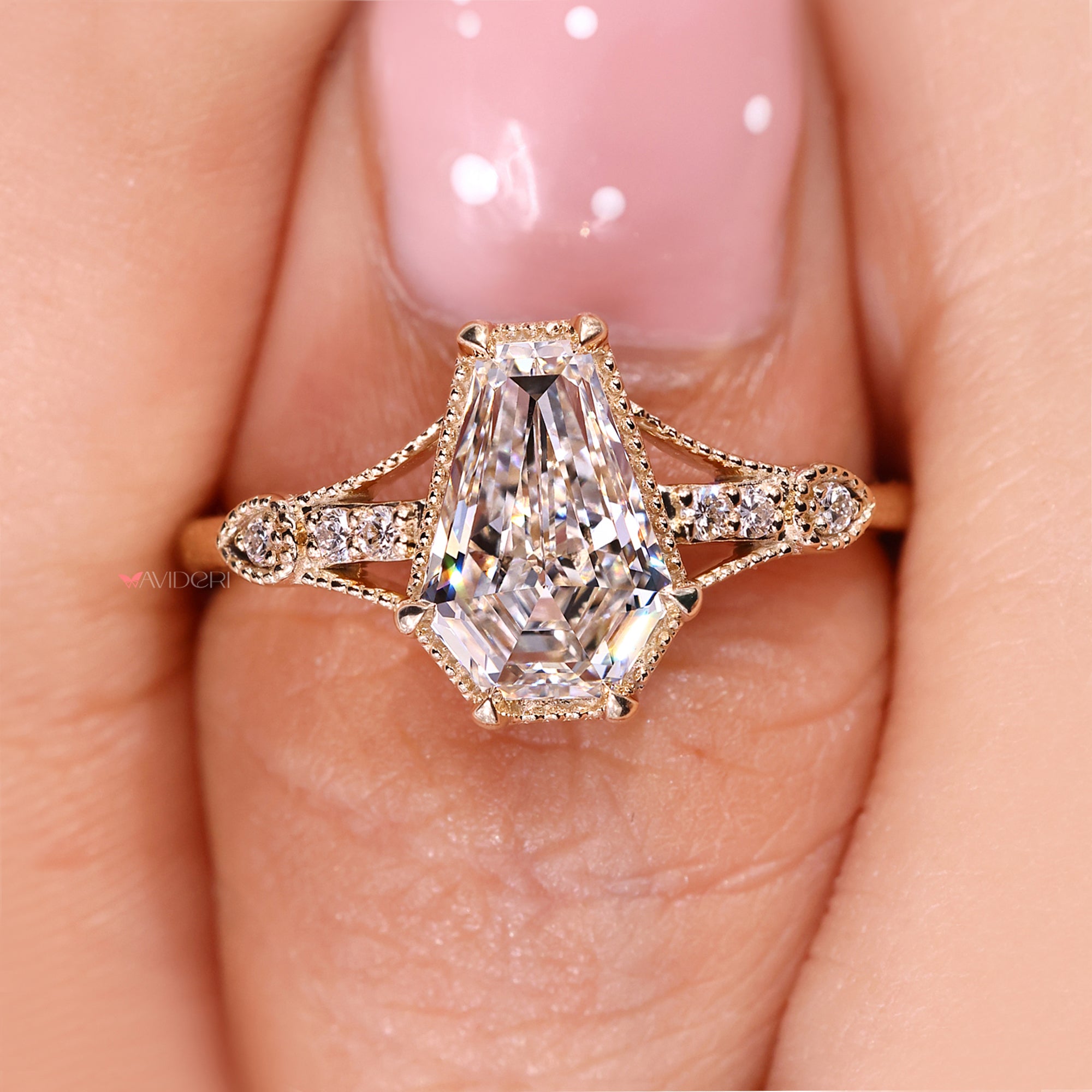 Six claw prong coffin cut diamond engagement ring.