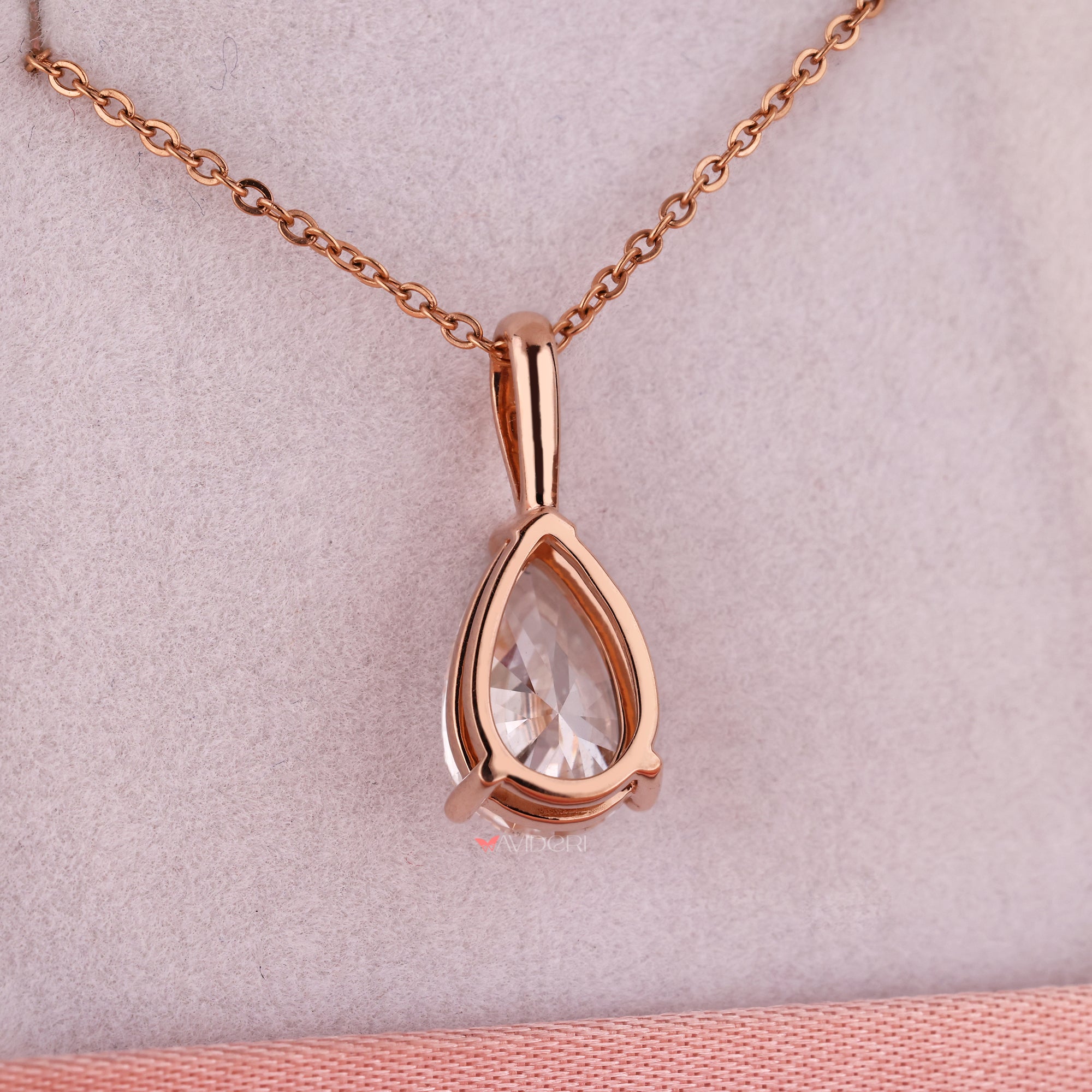 Rose gold pendant with pear shaped diamond pendant.