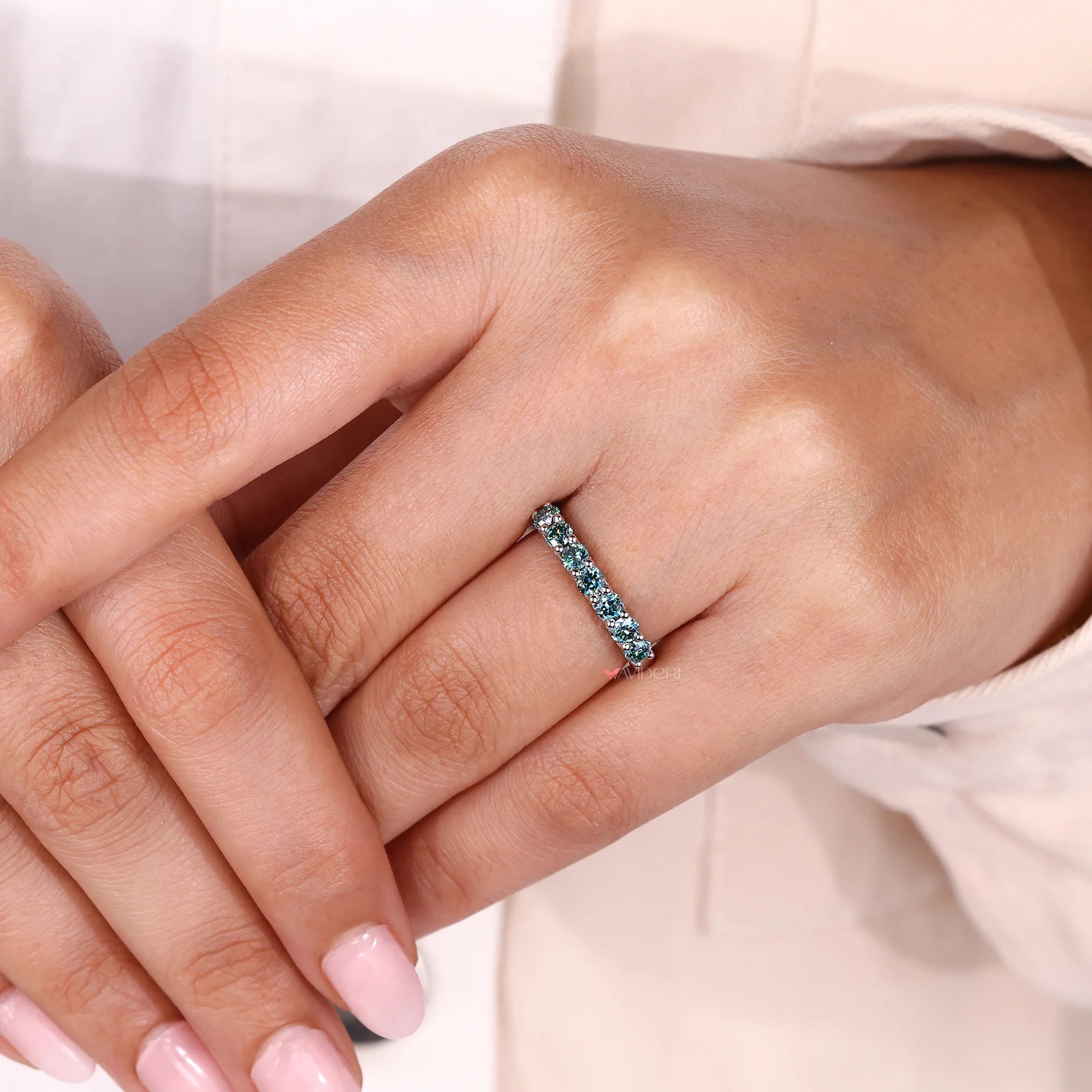Round cut wedding band with cyan blue wedding band.
