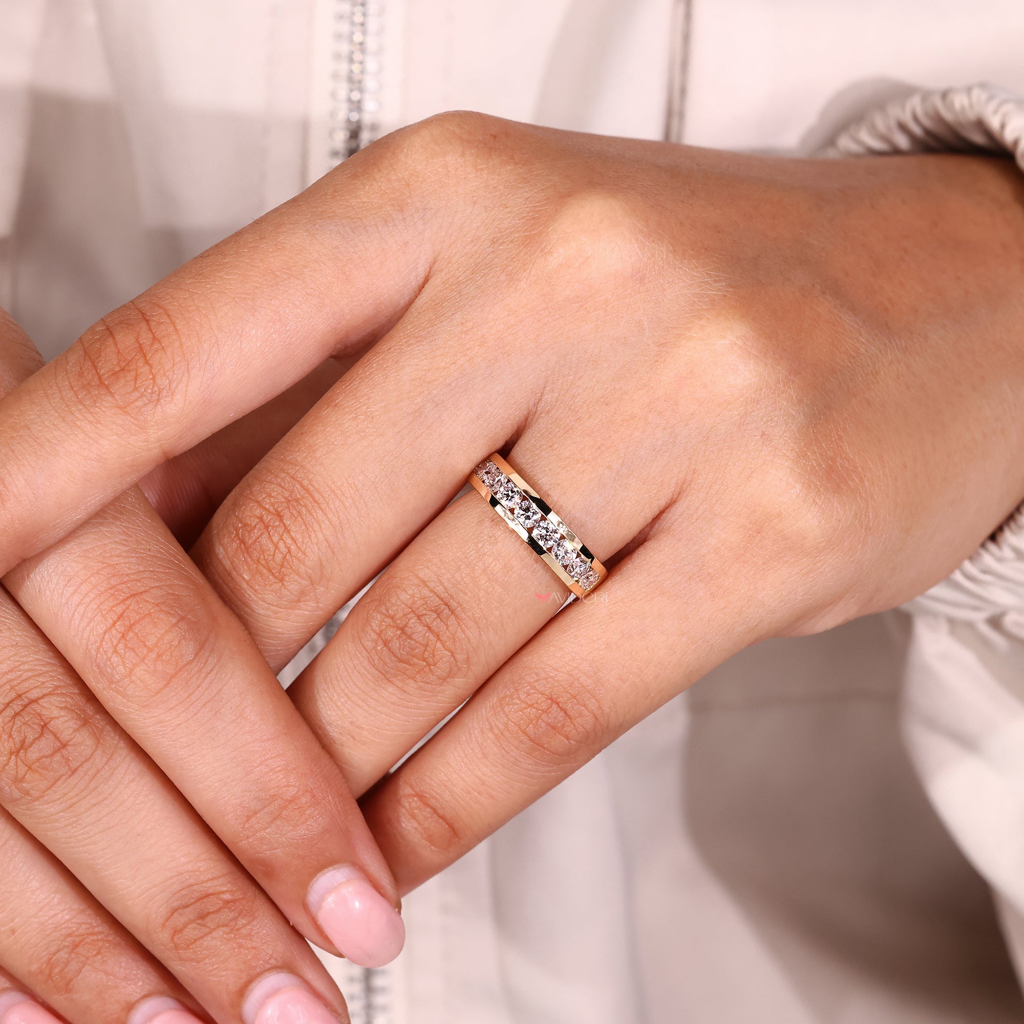 Round cut half eternity band with evenly spaced diamonds.