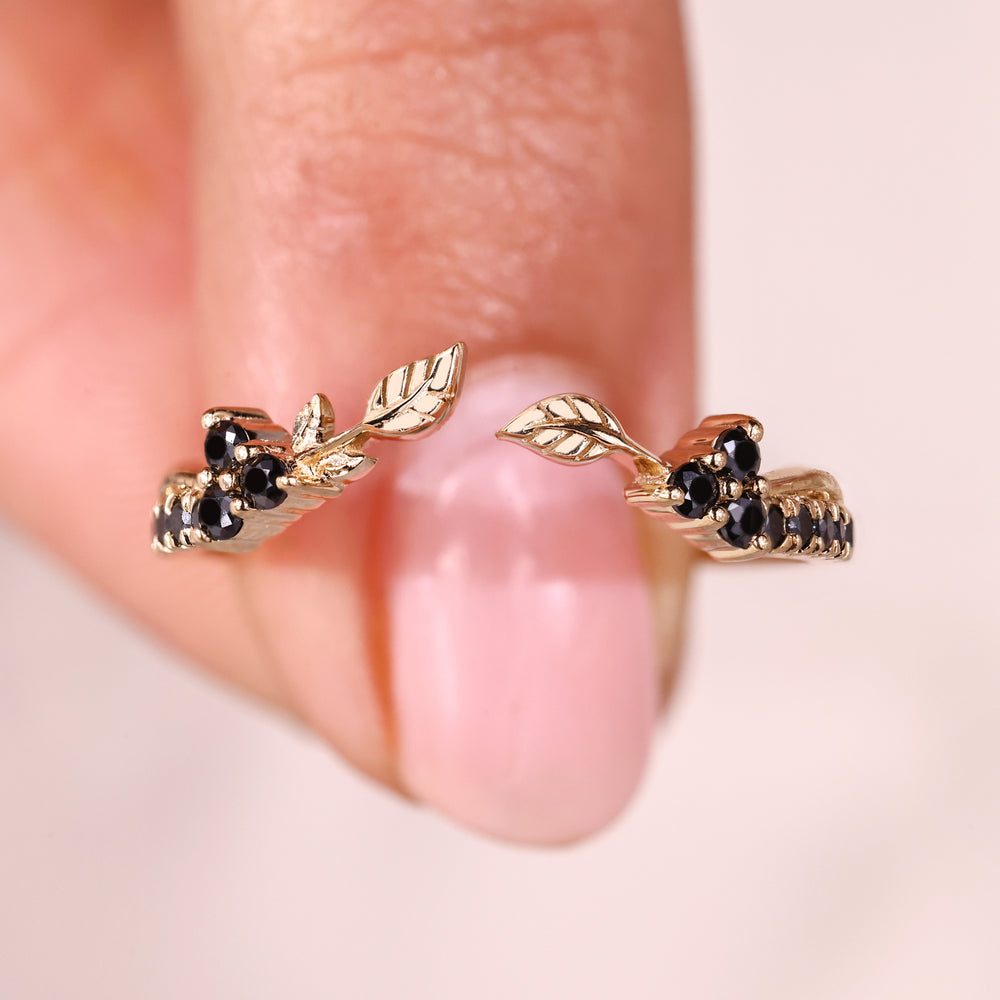 Nature inspired wedding band with open gap style and moissanite stones.