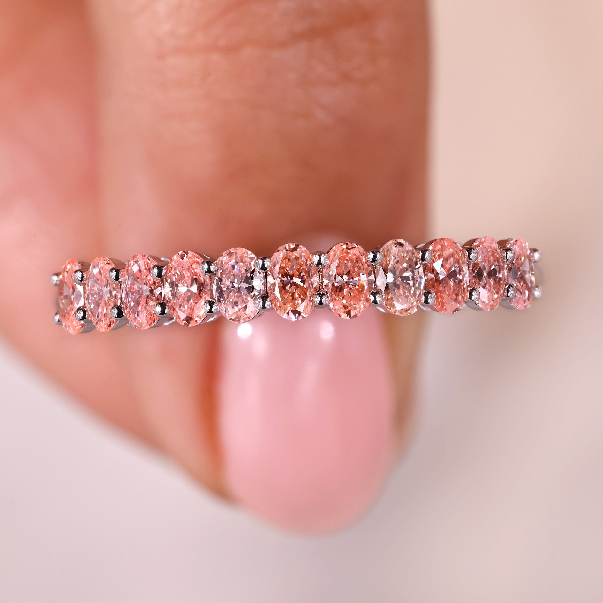 Elegant oval diamond band crafted from premium white gold.