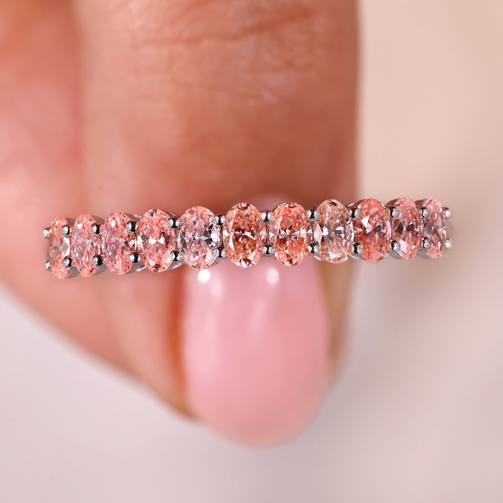 Elegant oval diamond band crafted from premium white gold.