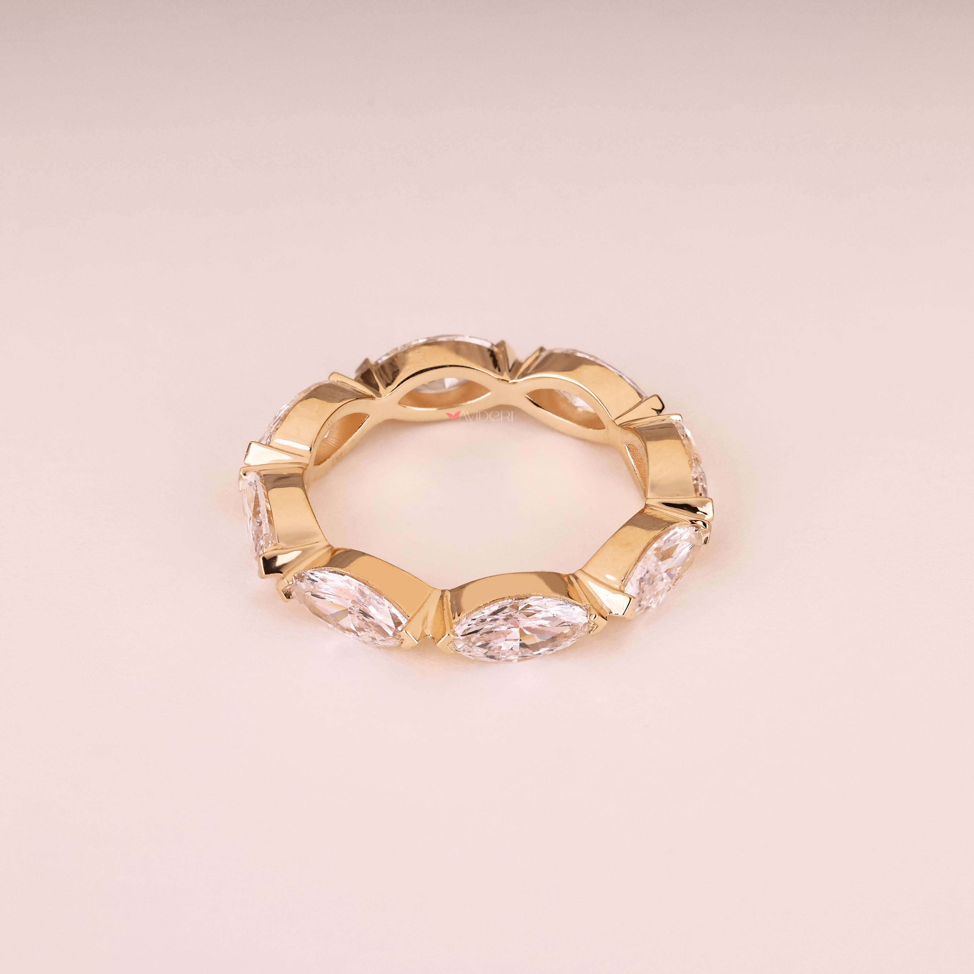 Eternity wedding band with marquise stones and V prongs
