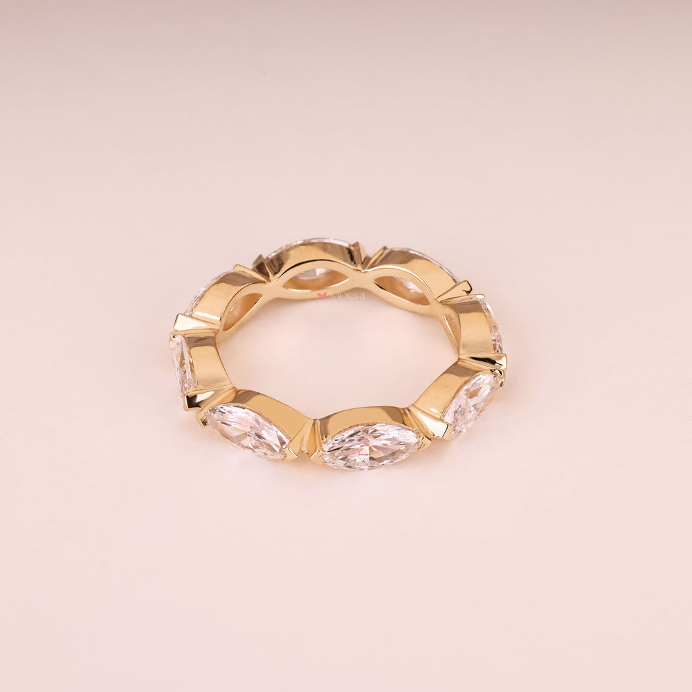 Eternity wedding band with marquise stones and V prongs
